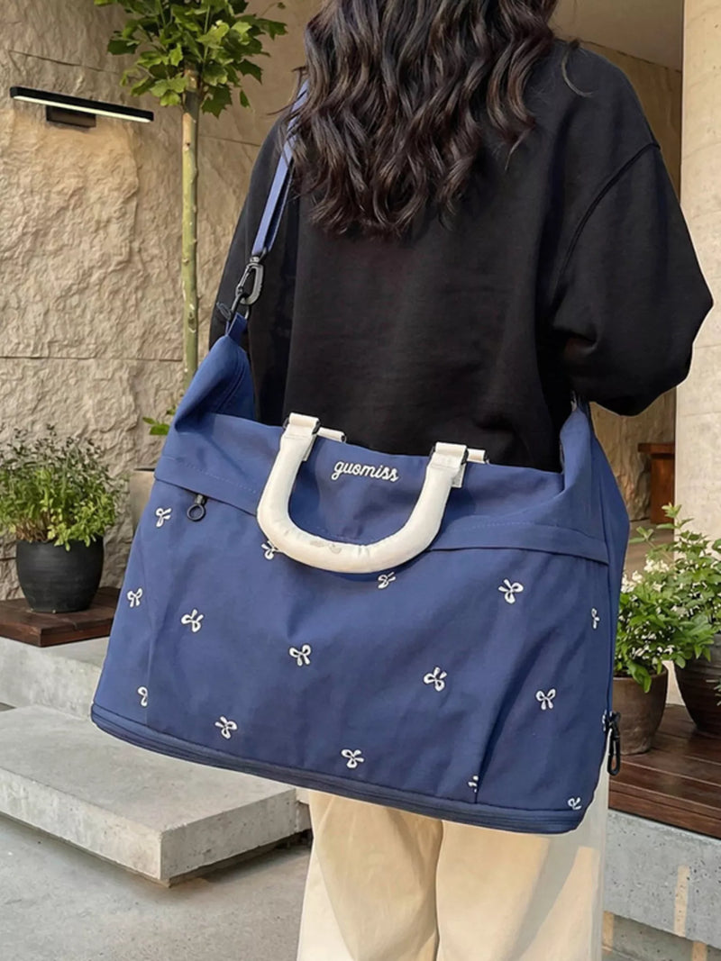 Bow embroidered travel bag in cream white