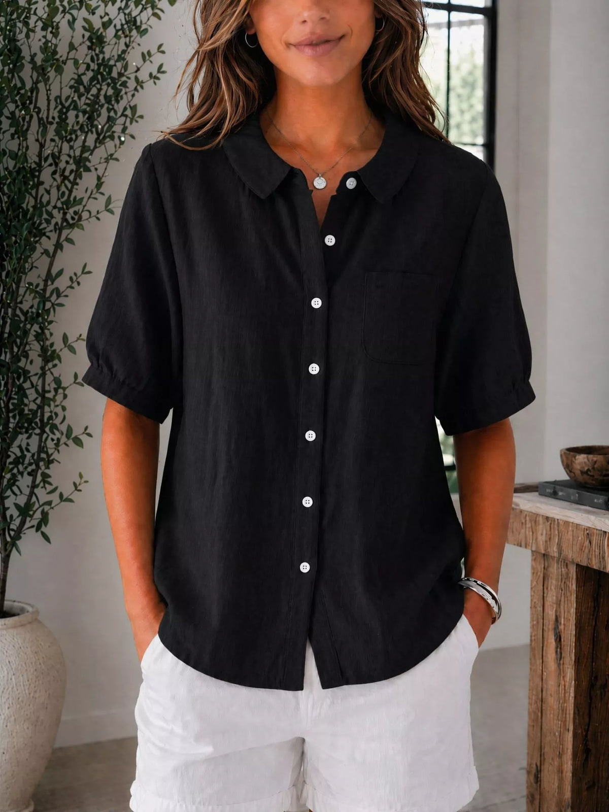 Button up shirt styled tucked into trousers