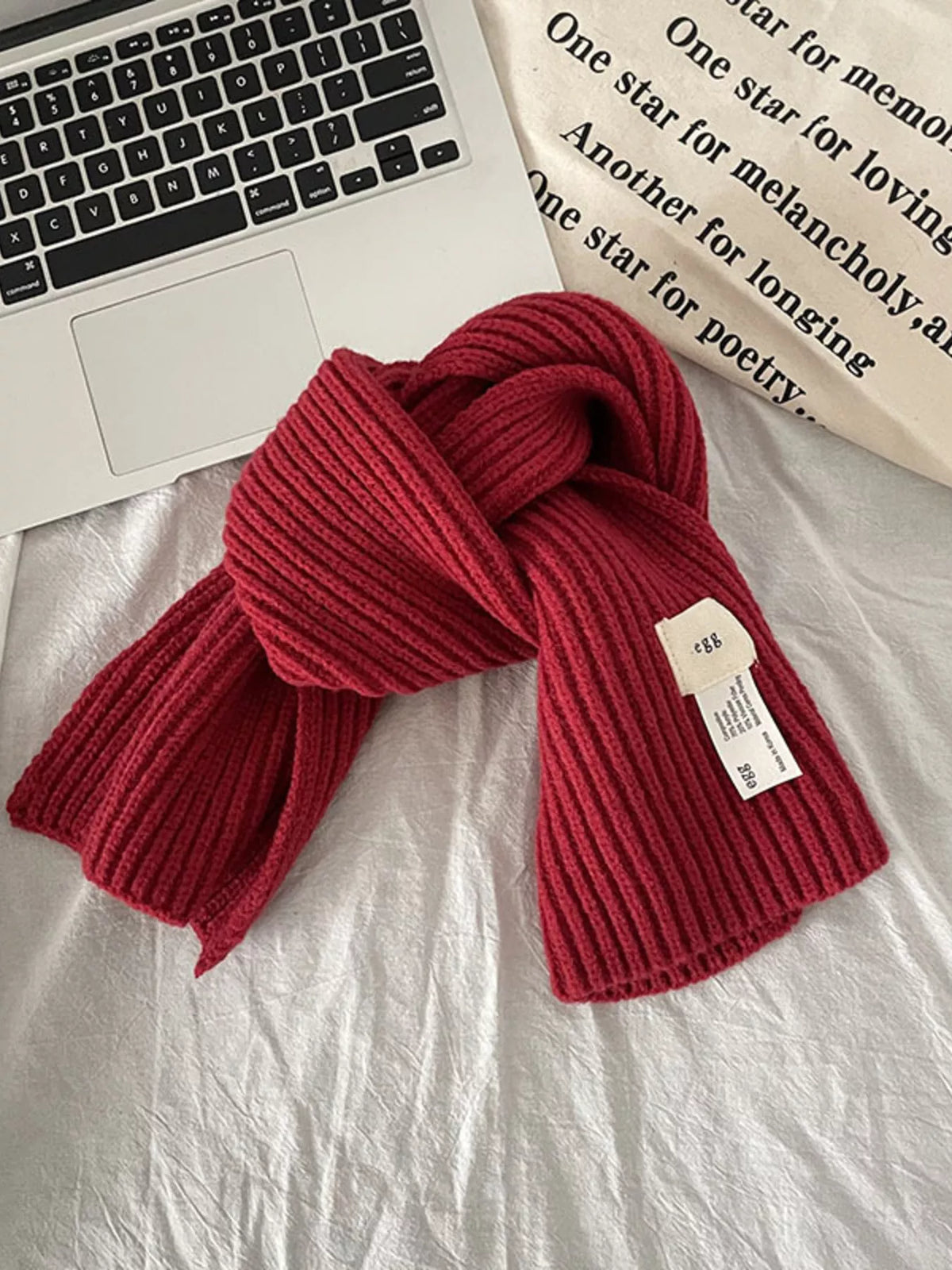 Milky white ribbed scarf styled with a coat
