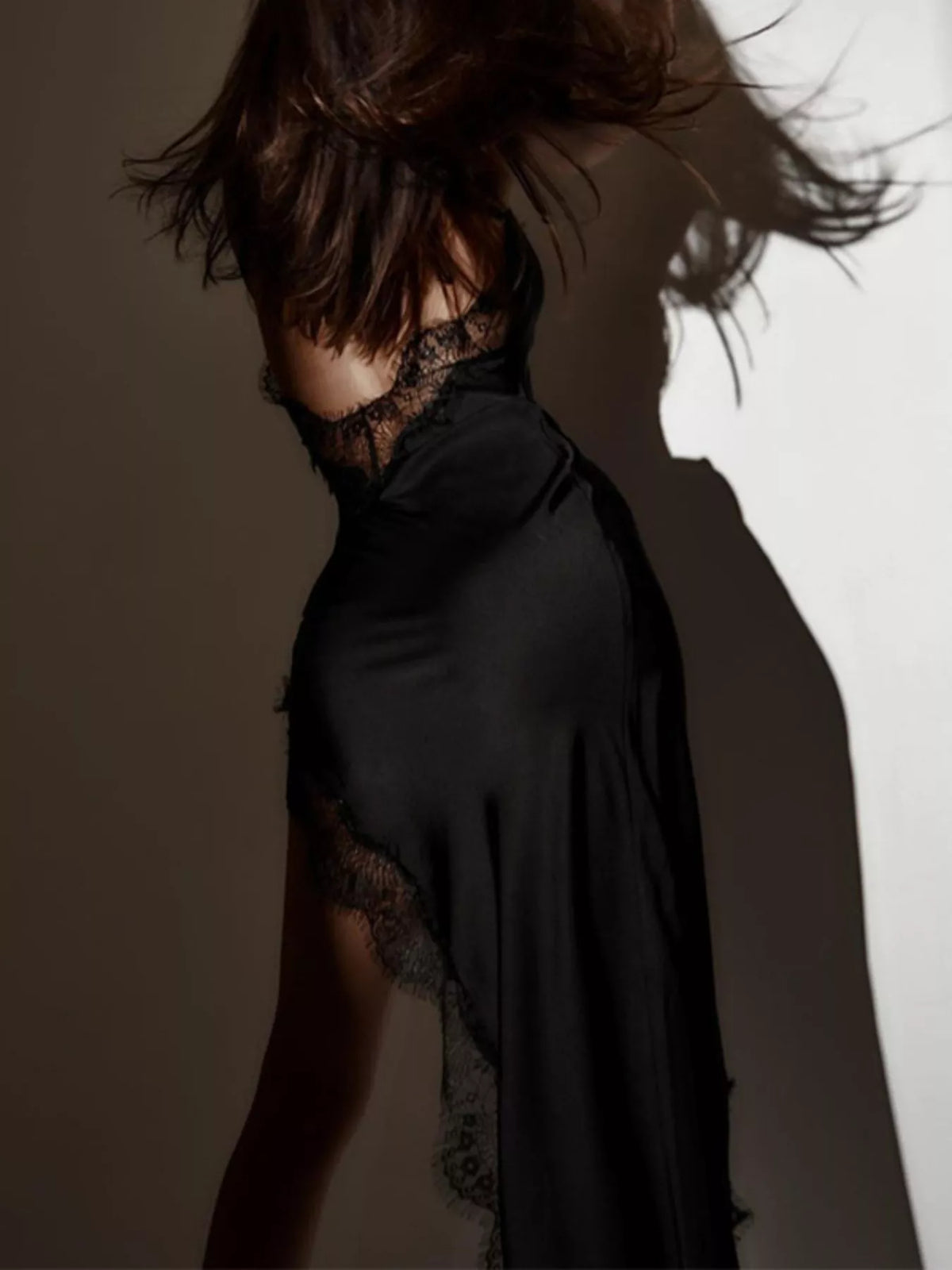 Split hem detail on the black spaghetti strap dress