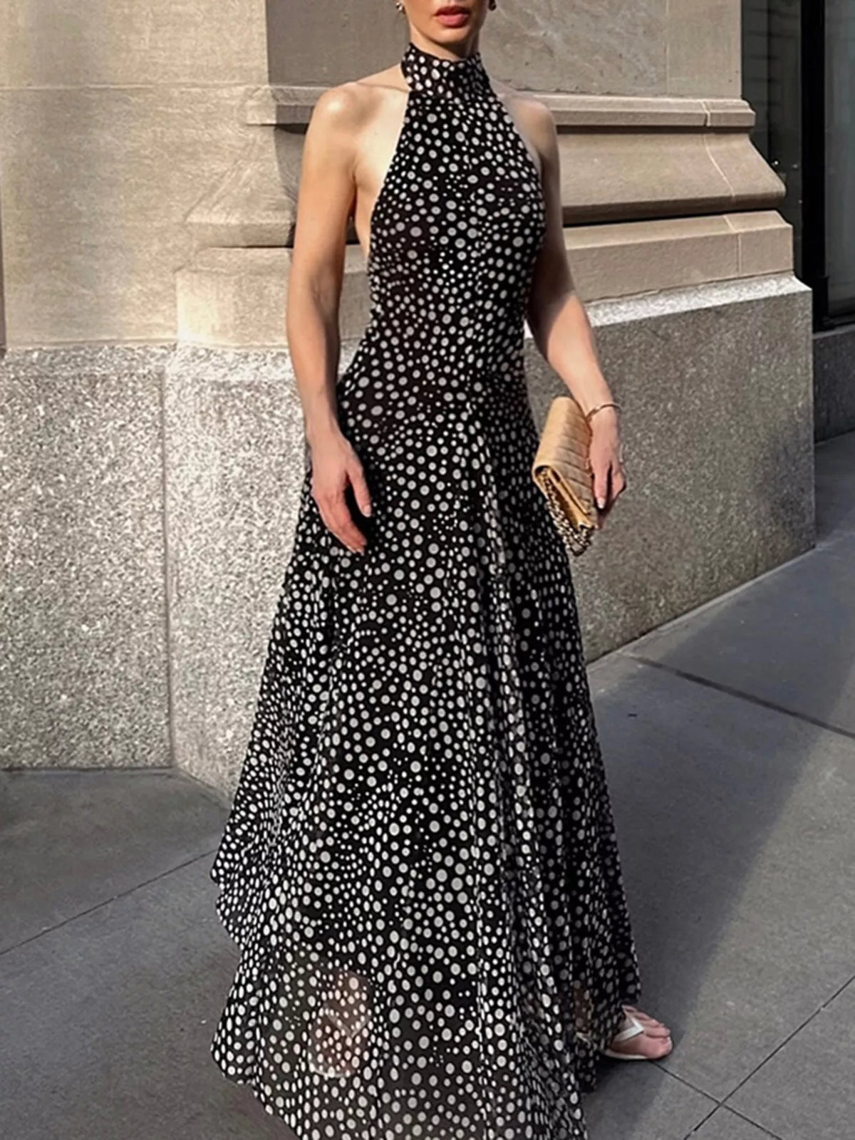 Black halter neck polka dot maxi dress, side profile