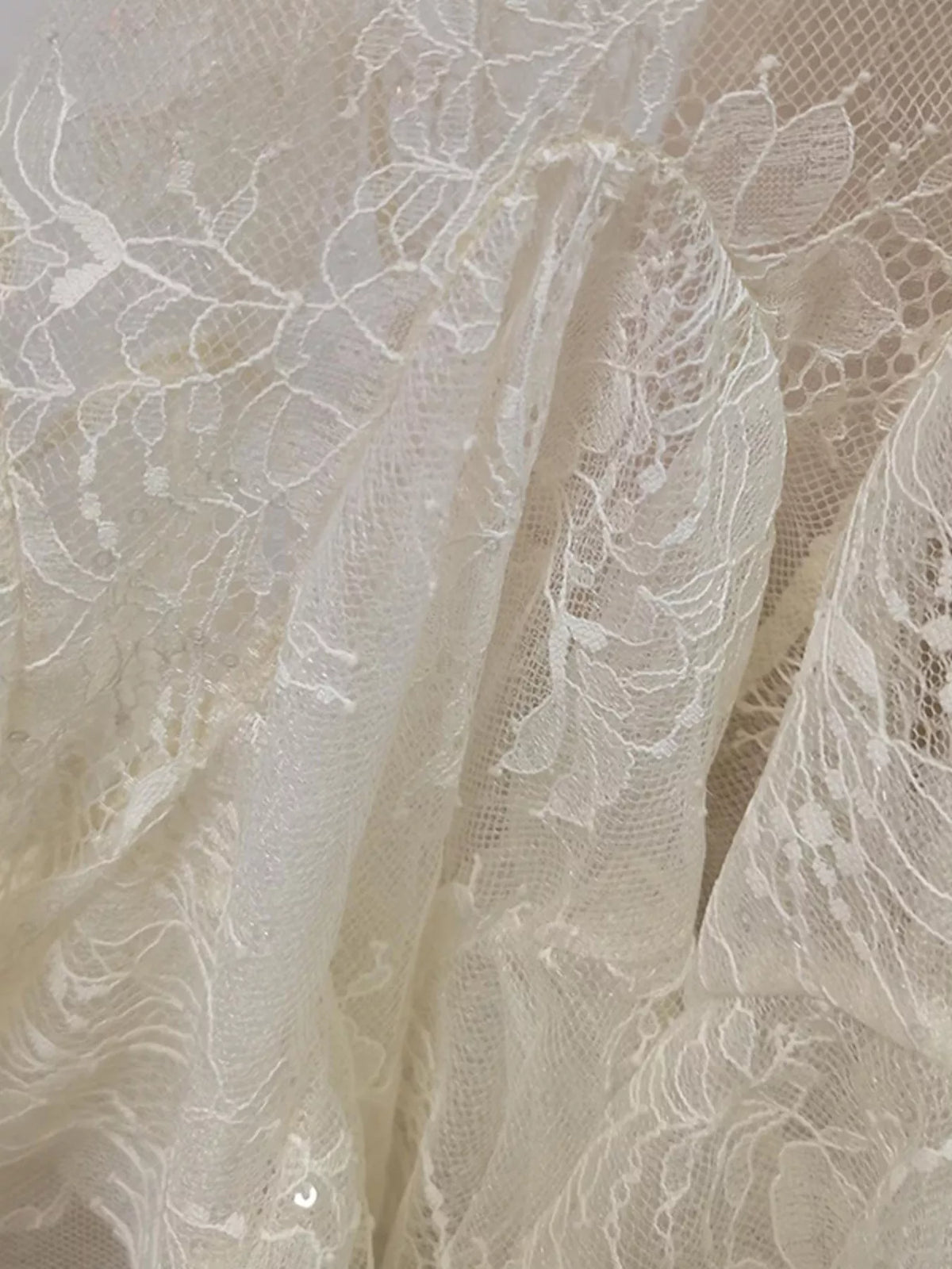 ruffled hem lace long sleeve dress close up view