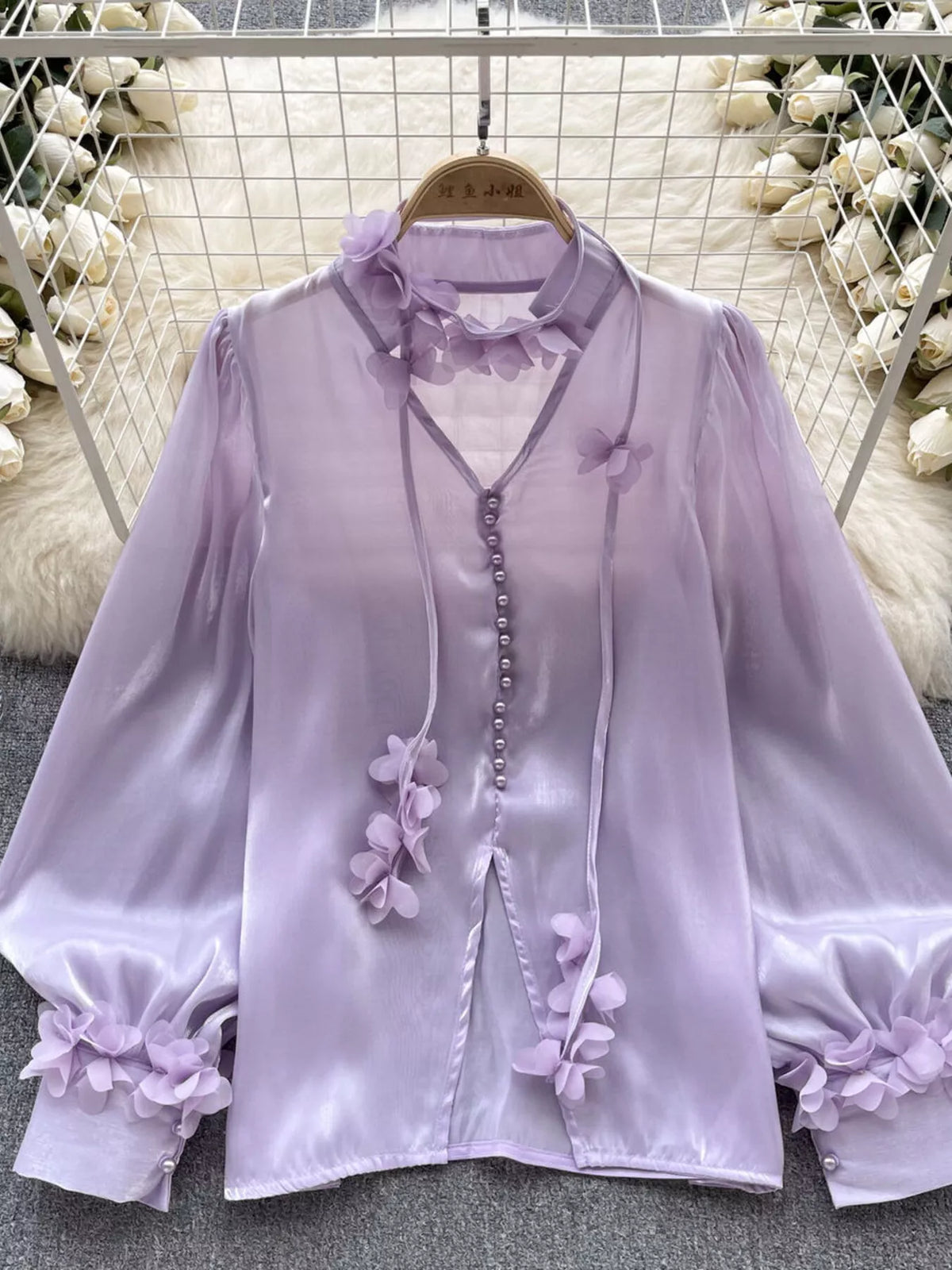 Sheer floral shirt in pink styled over a camisole