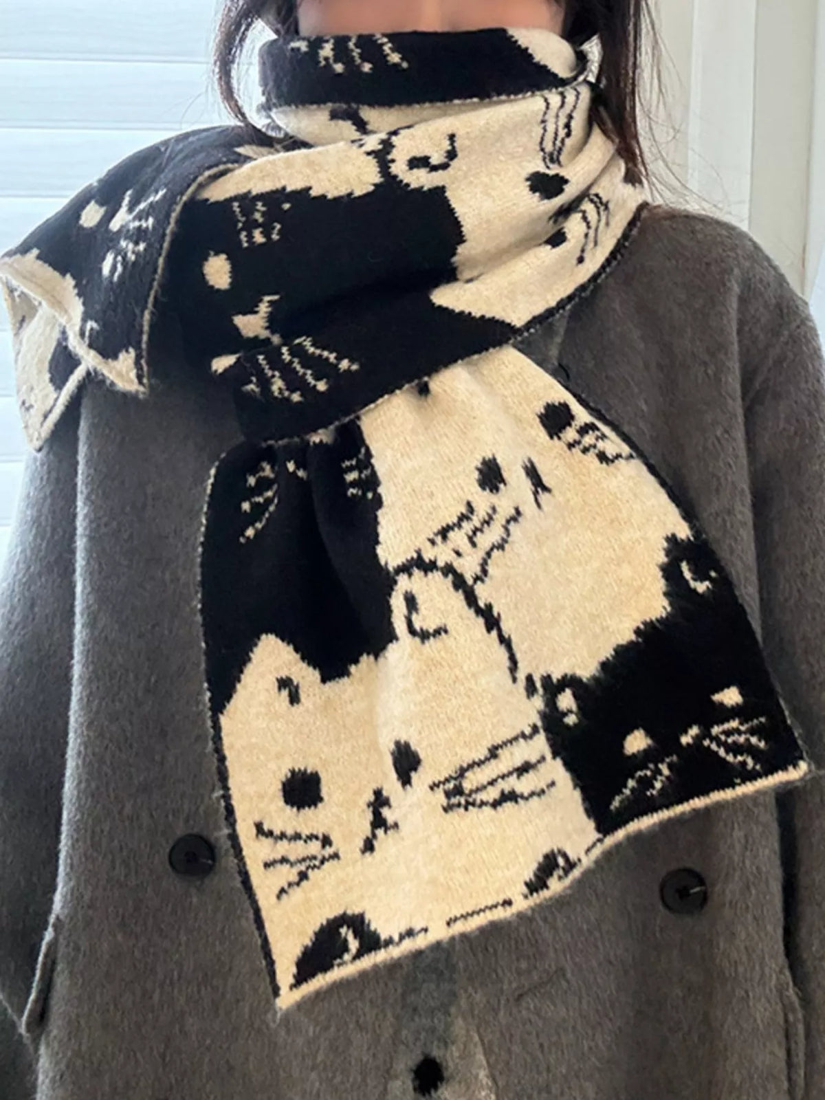 Cat pattern scarf shown in black