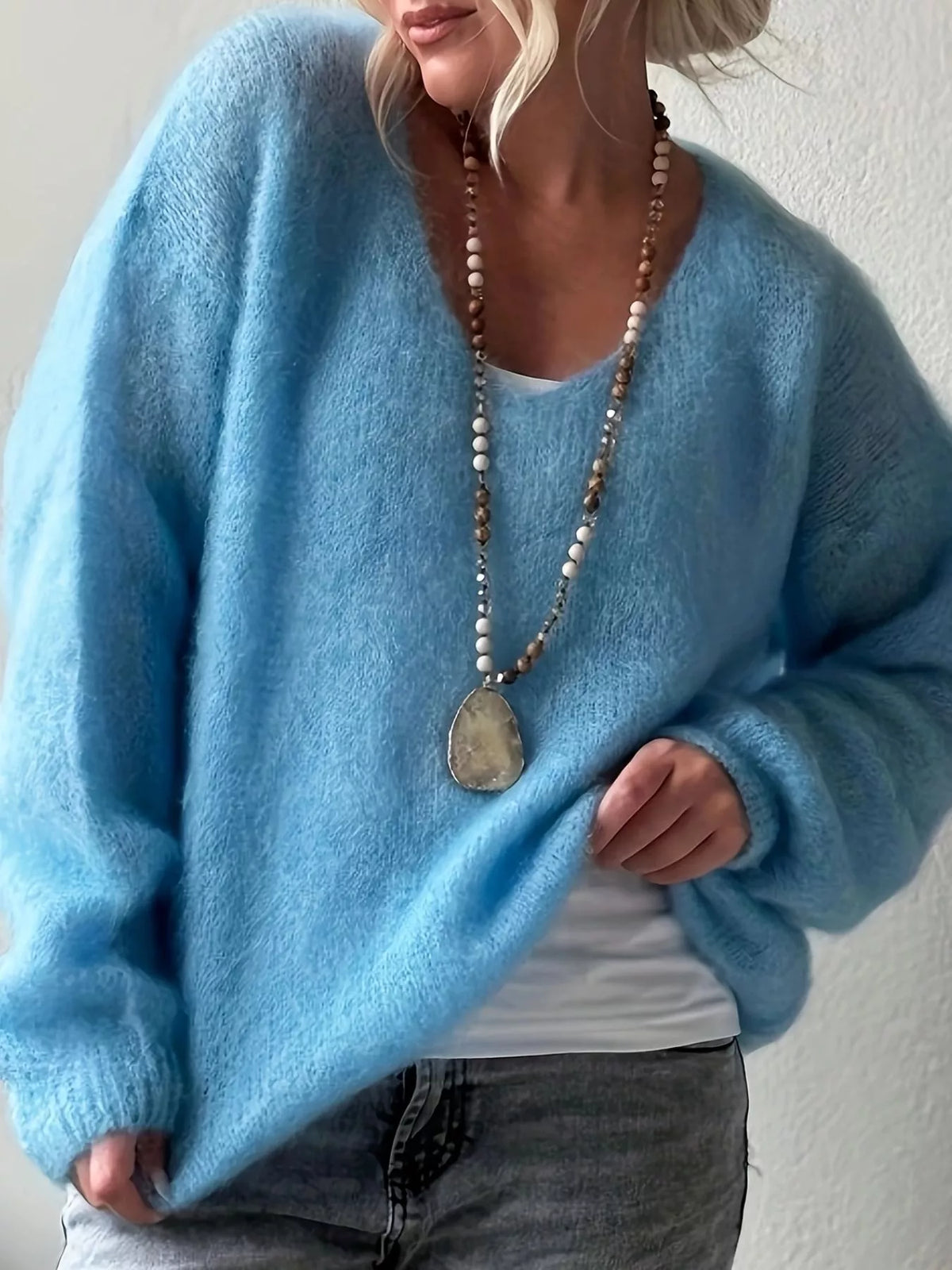 v neck dropped shoulder sweater sleeve detail