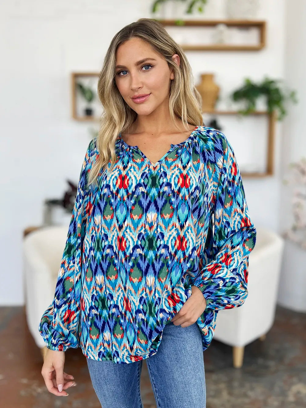 Movement view of the flowy balloon sleeve blouse