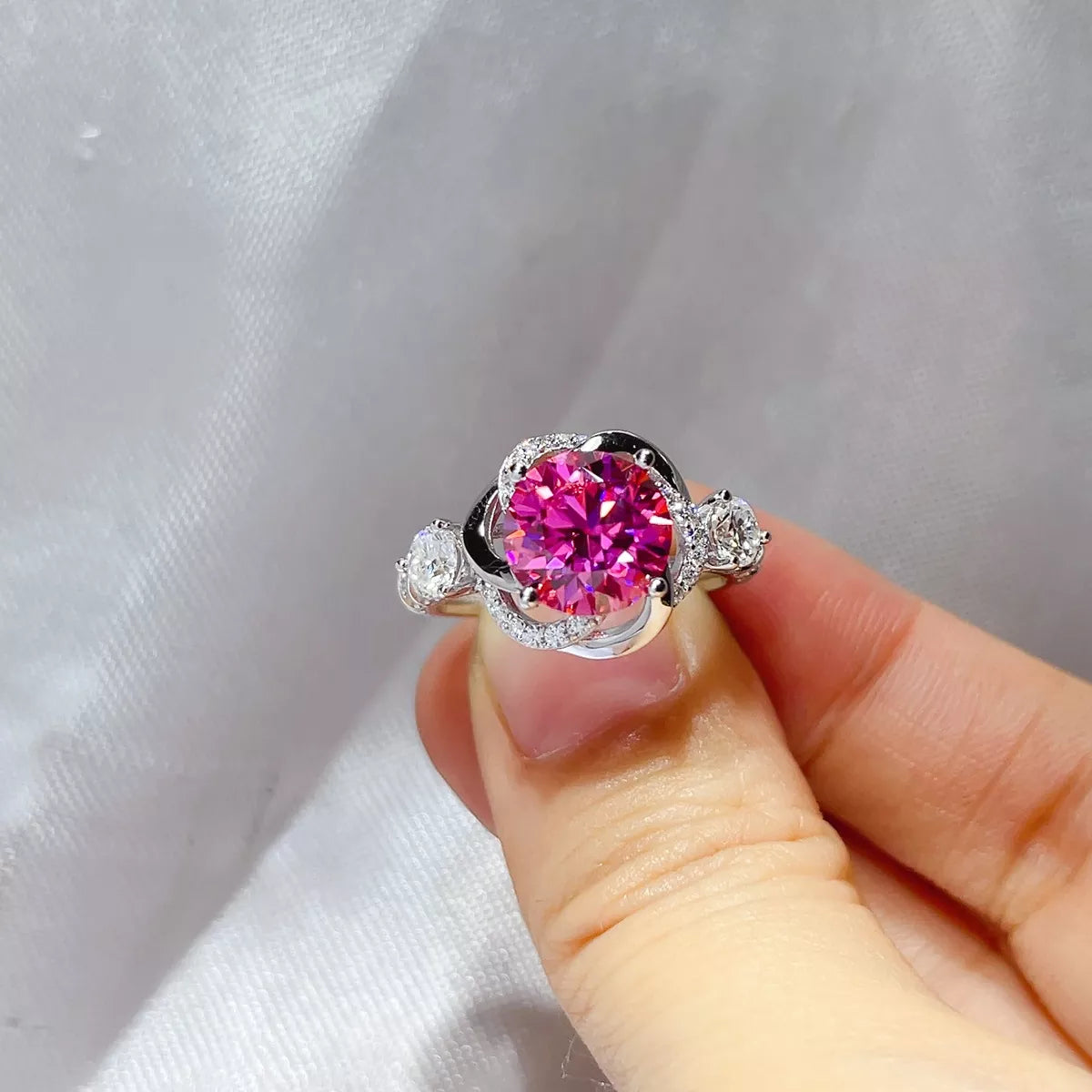 Side profile of the silver band and pink stone