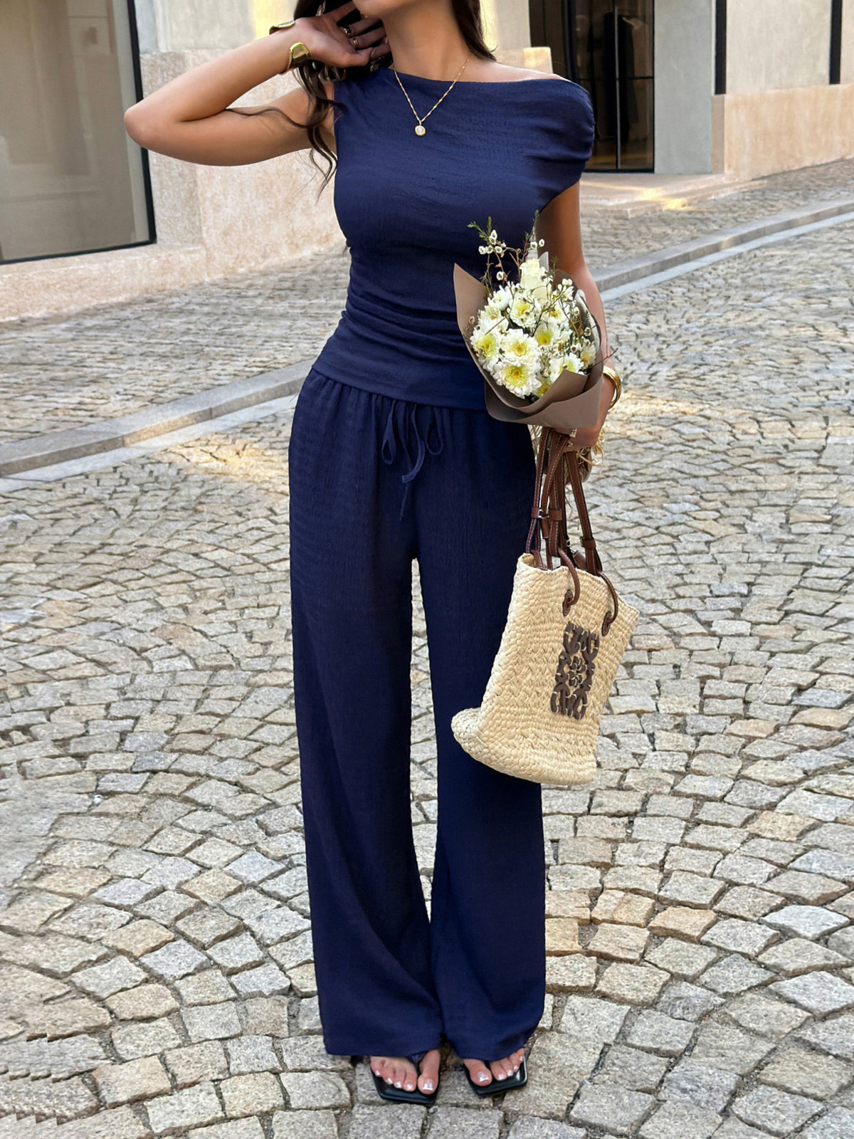 Navy asymmetrical neck top and pants two piece set front view