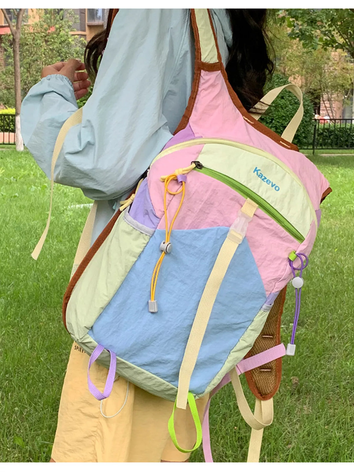 Pastel blue color block backpack flat lay styling