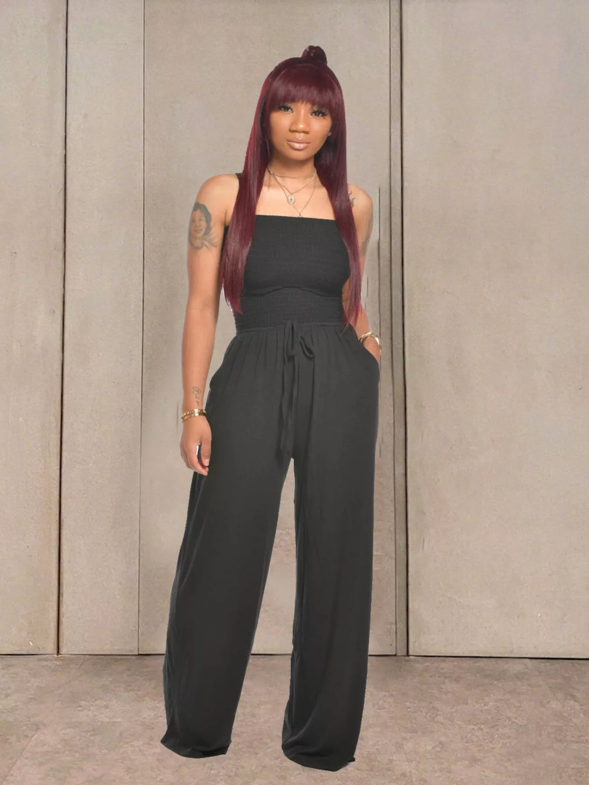 Black strapless smocked wide leg jumpsuit styled view