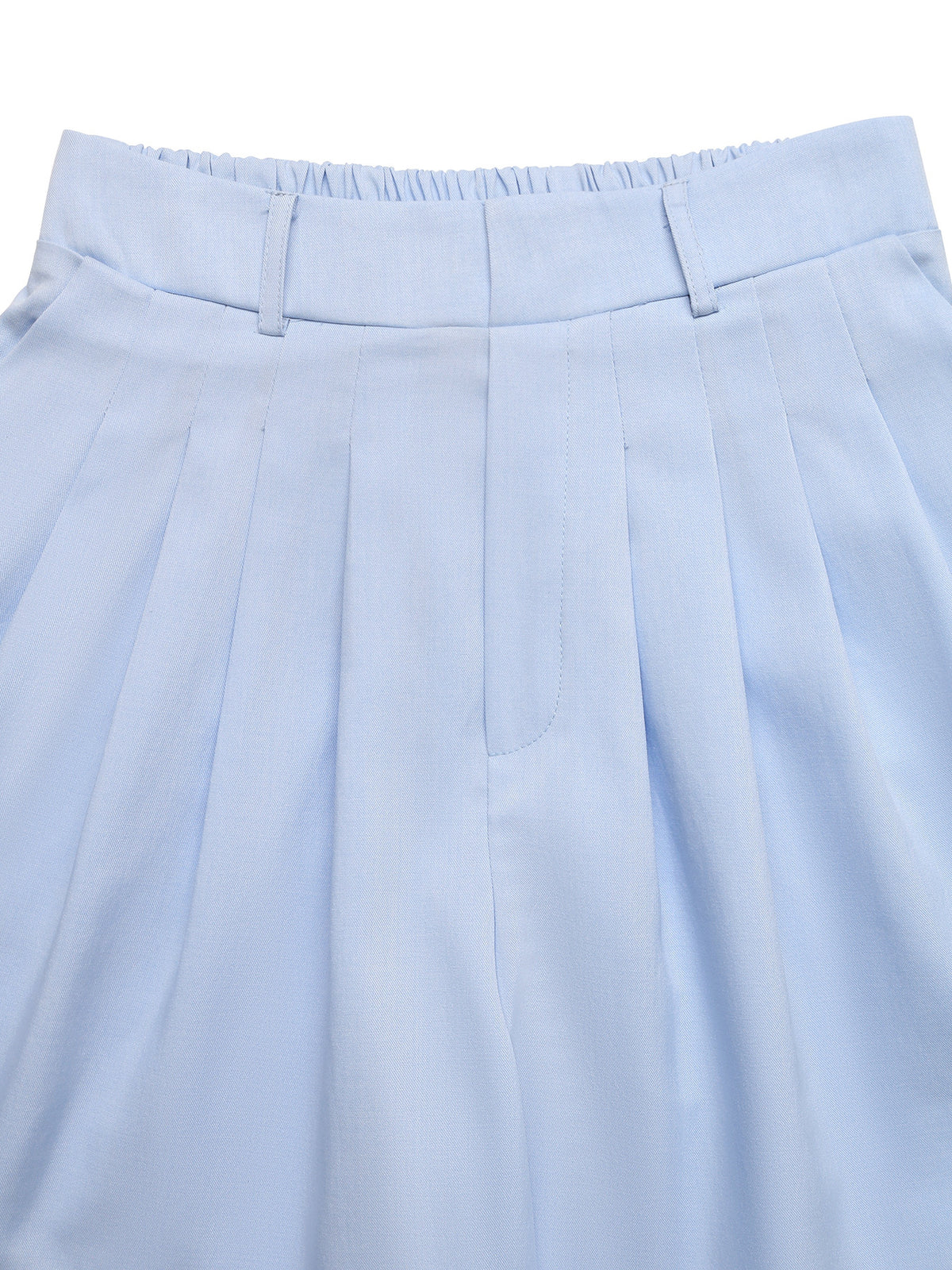 Model styling the high waisted shorts with a tucked in top