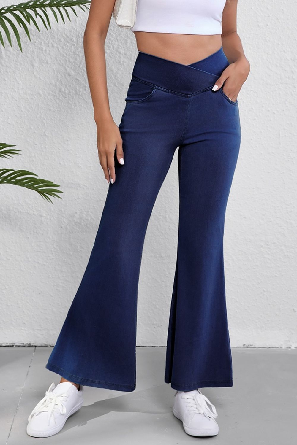 Dark navy flare jeans side profile showing flared leg