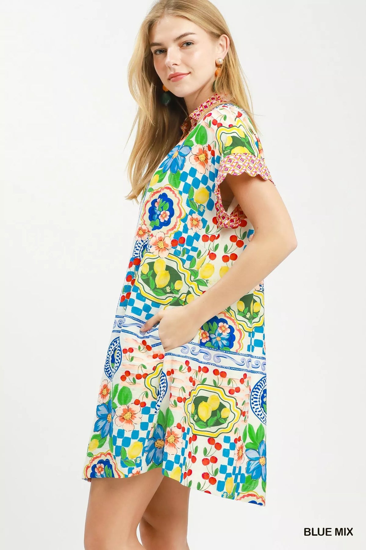 Blue printed flutter sleeve dress with contrast trim side view
