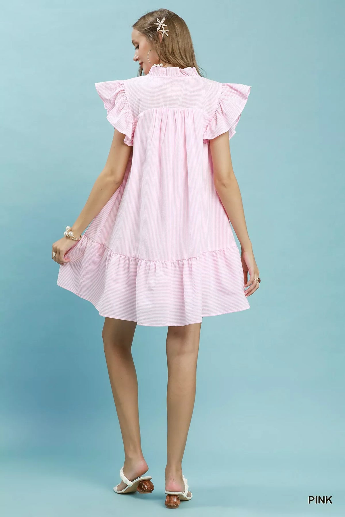 Pink striped smocked yoke ruffle dress side view