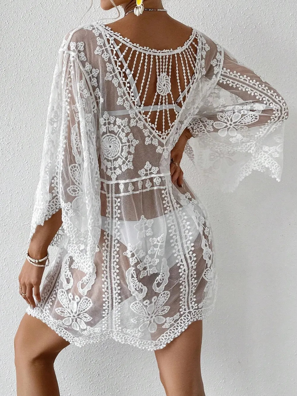 Lace fabric detail on cover up