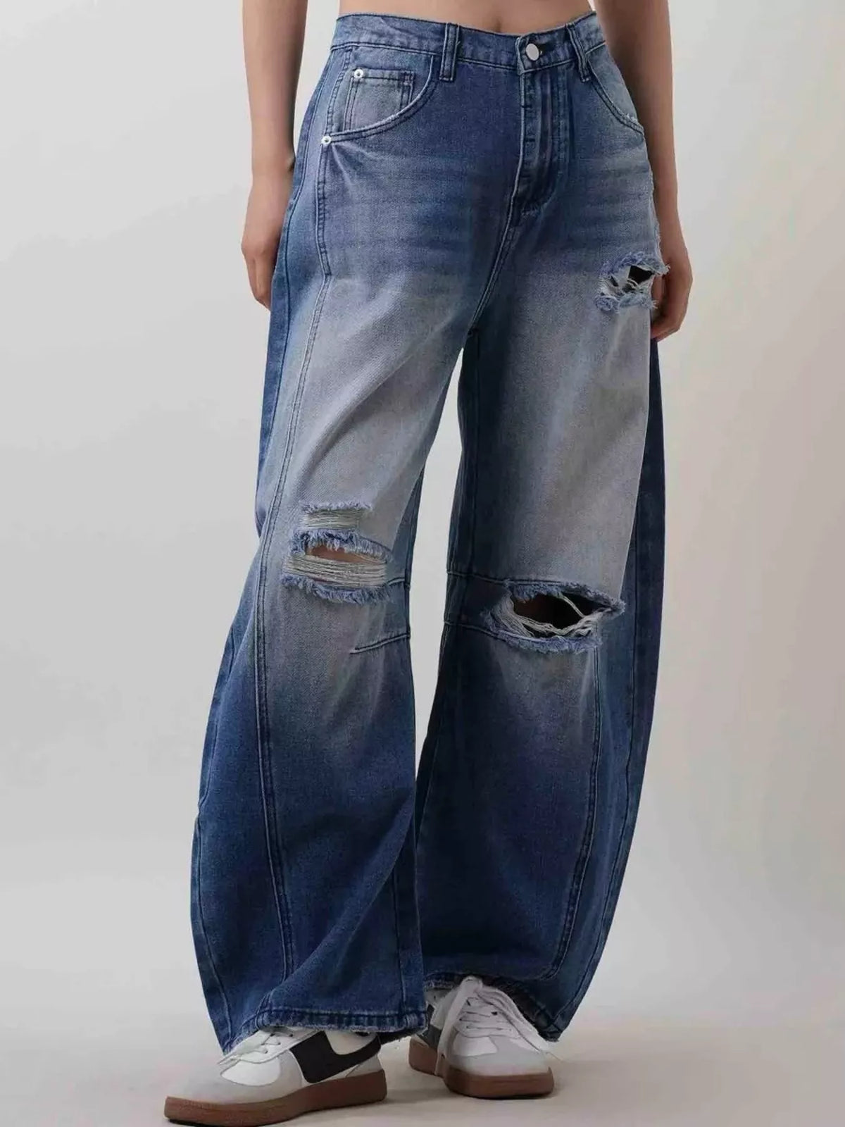 Back view of distressed two tone jeans