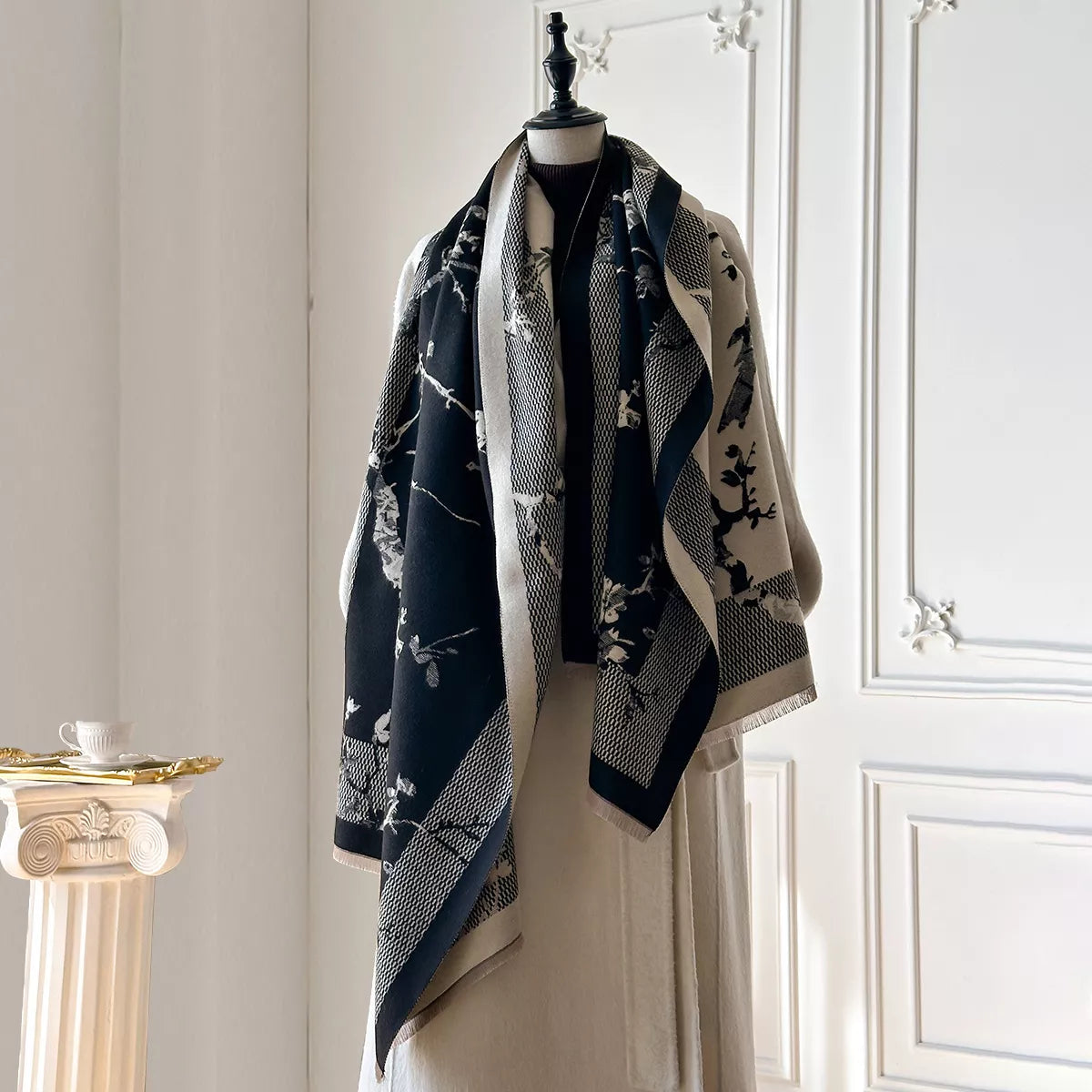 Neutral scarf styled over a tailored coat