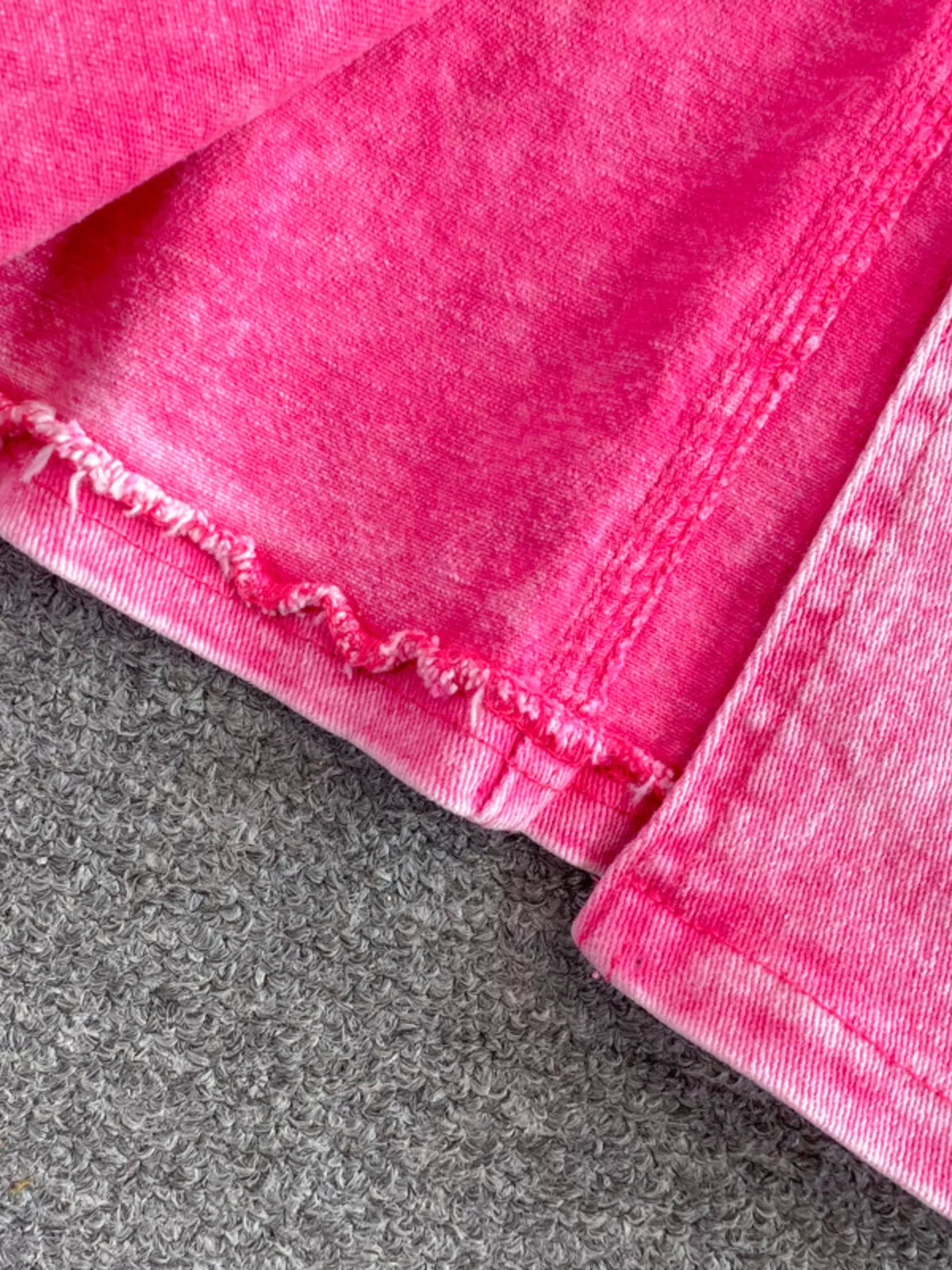 Pink denim jacket pocket detail