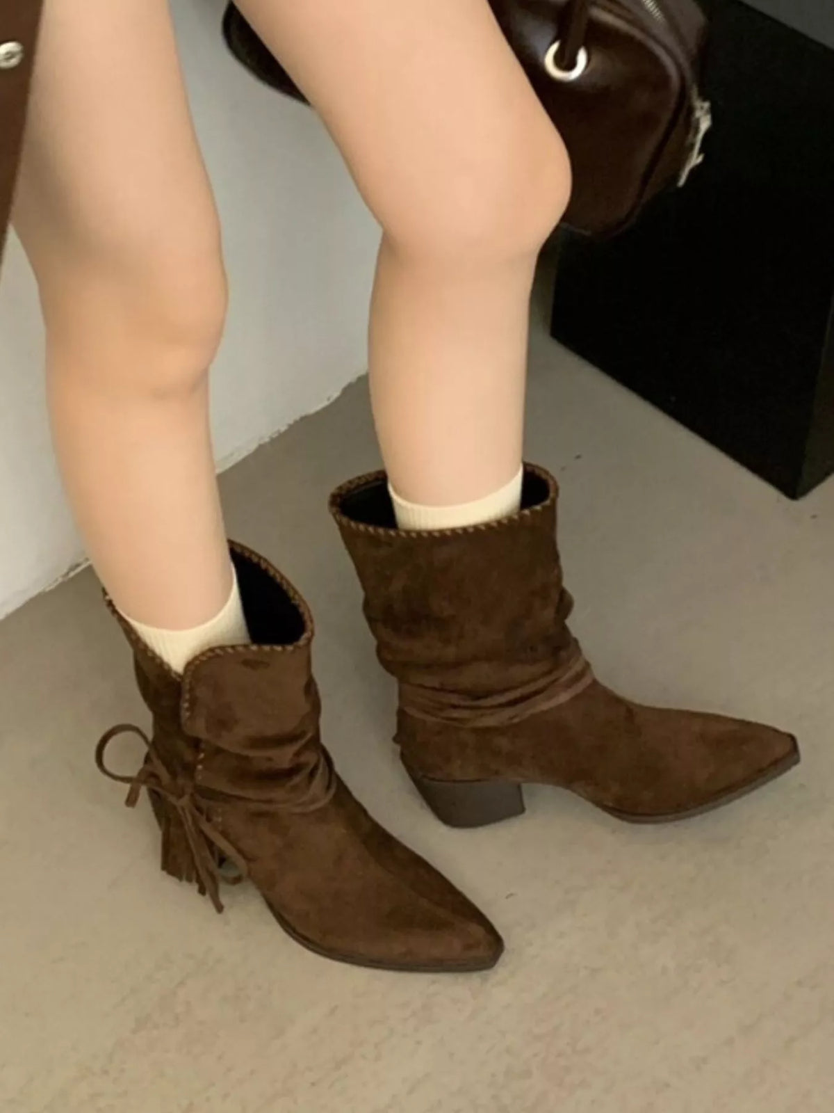 point toe block heel boots tan top down view