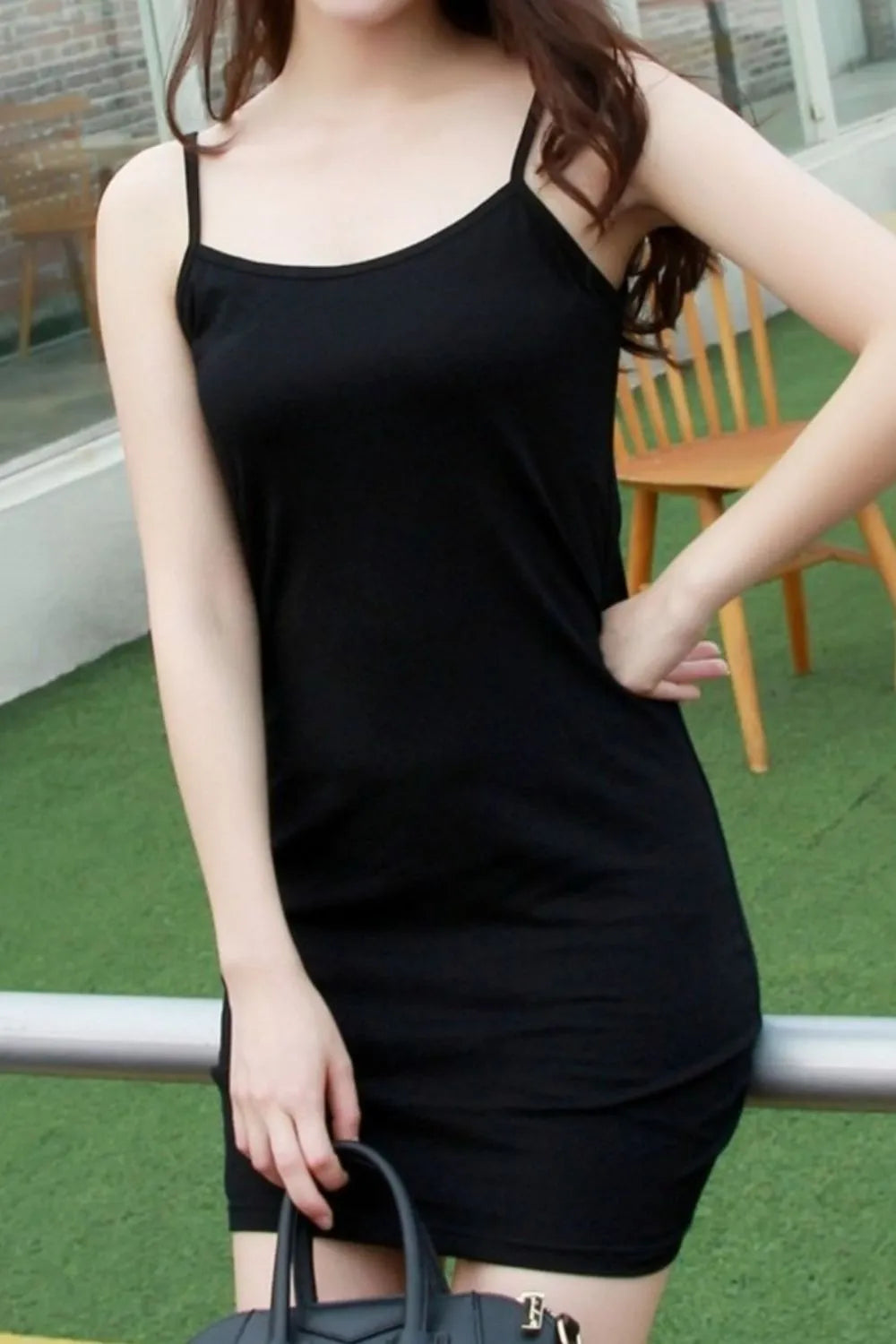 Side view of black scoop neck cami mini dress
