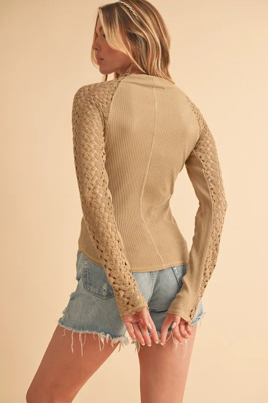 Tan mock neck crochet sleeve top back view