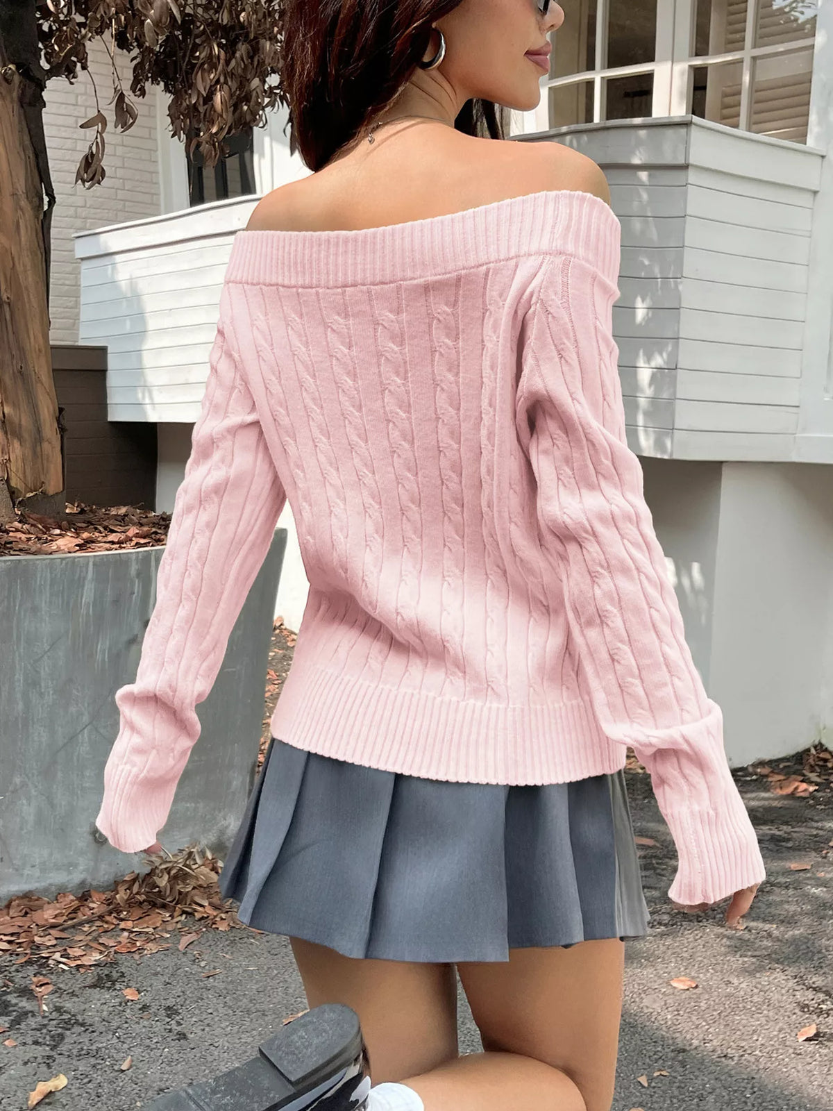 off shoulder cable knit sweater folded flat