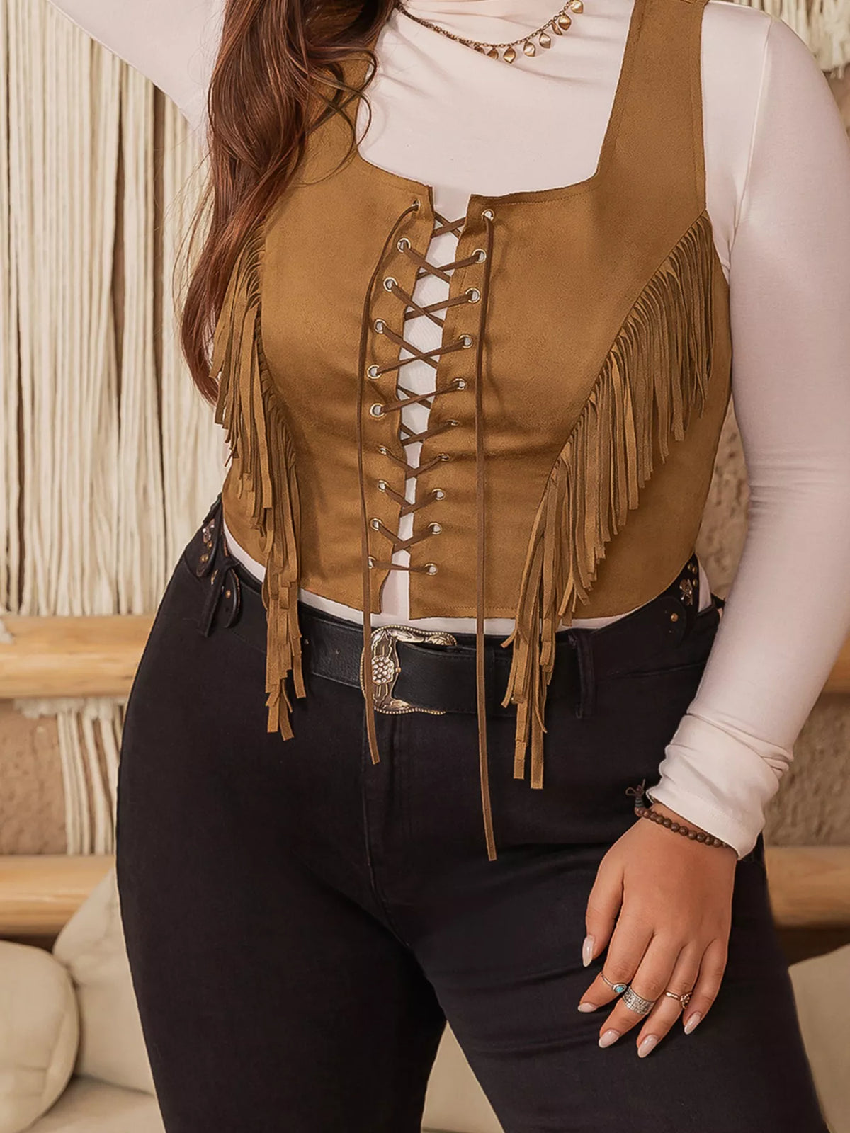 Suede vest showing tassel fringe detail