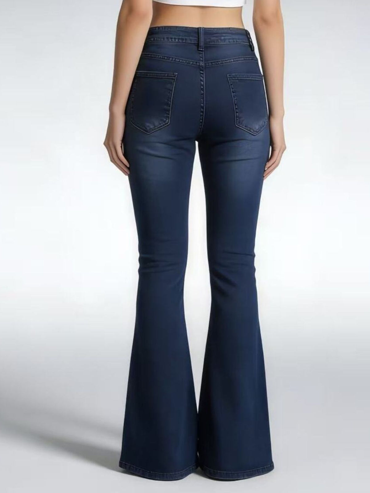 Model wearing vintage wash flare jeans