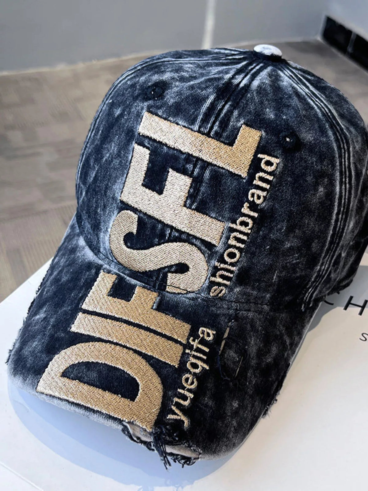 Distressed cotton baseball cap shown from the back