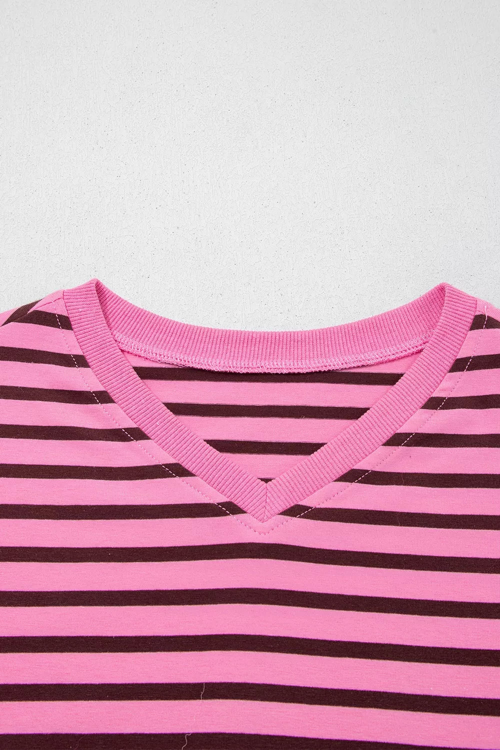 Hem and body length detail on the striped v neck top