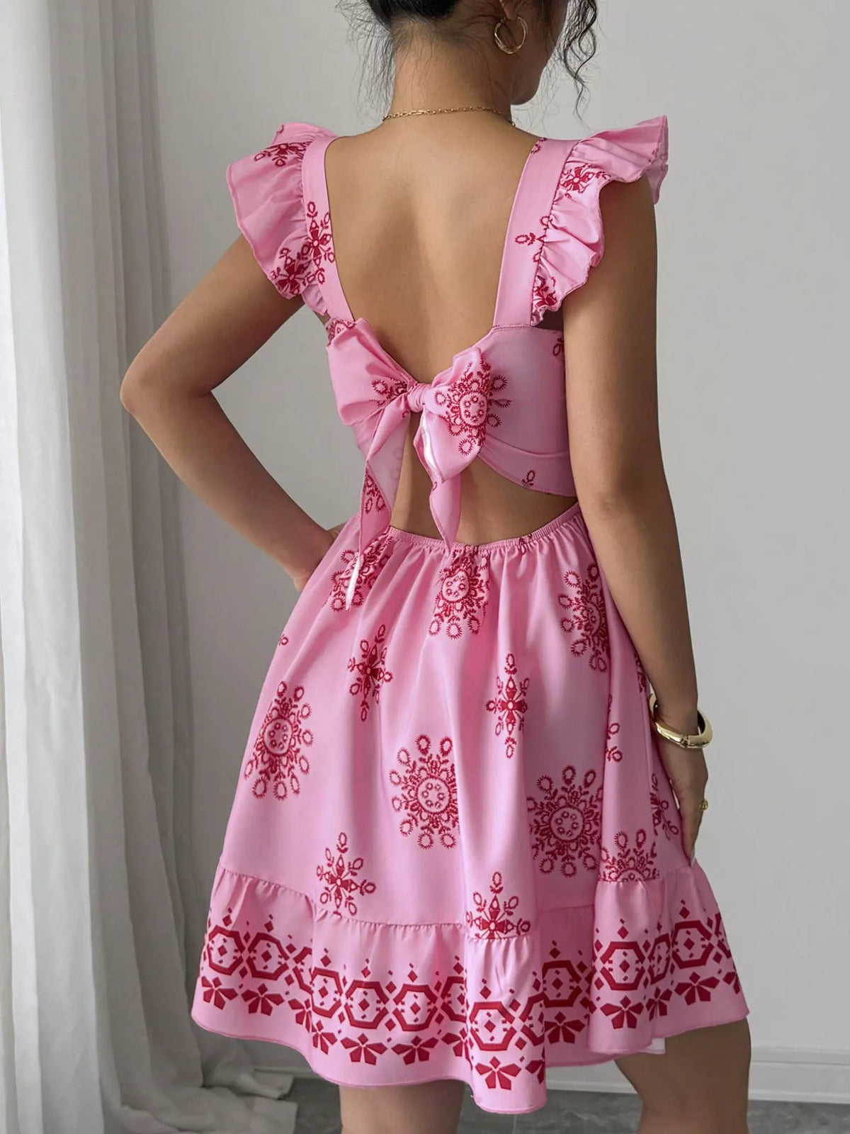 Fourth colorway of the printed bow back dress