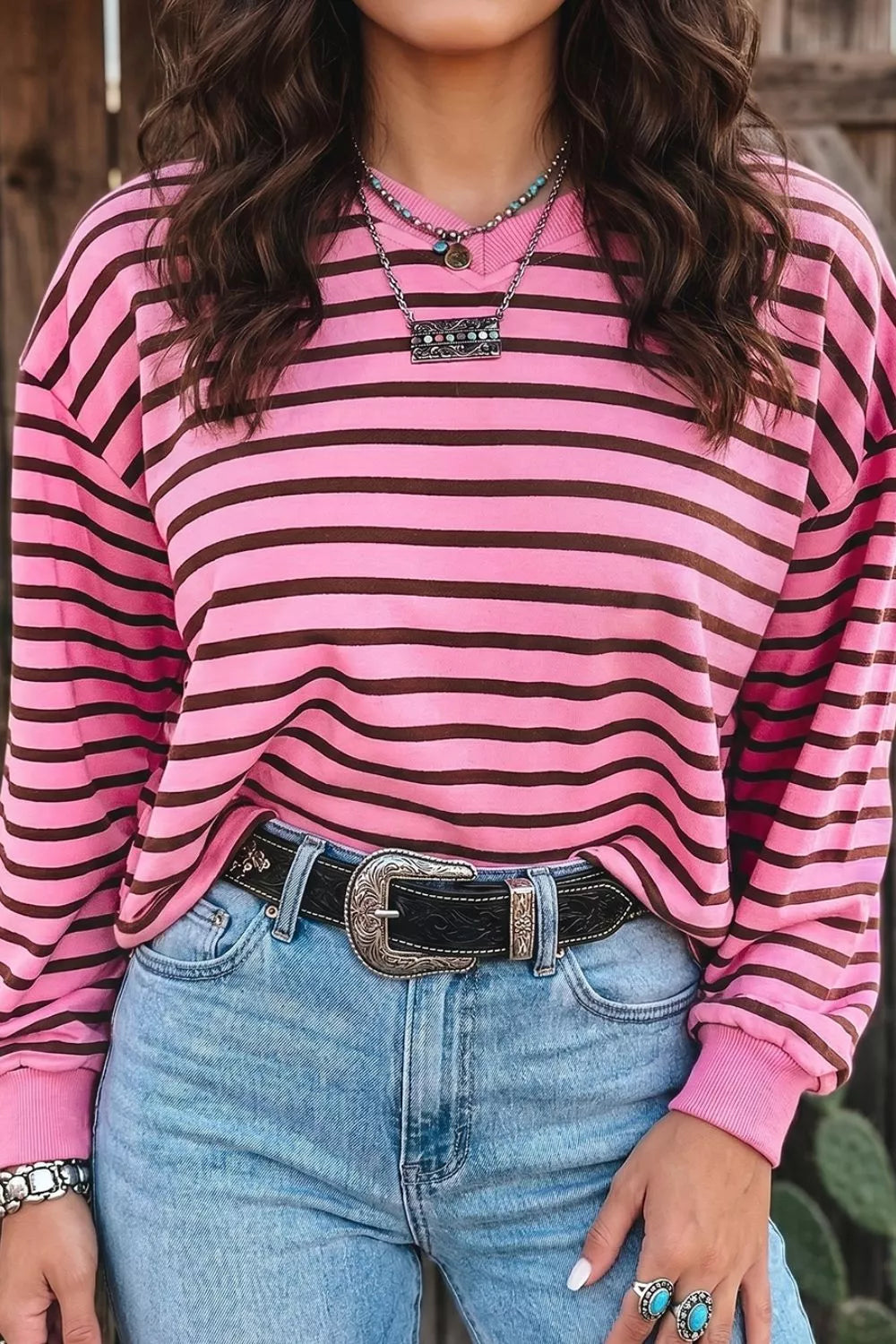 Close up of the v neckline on the striped cotton blend top