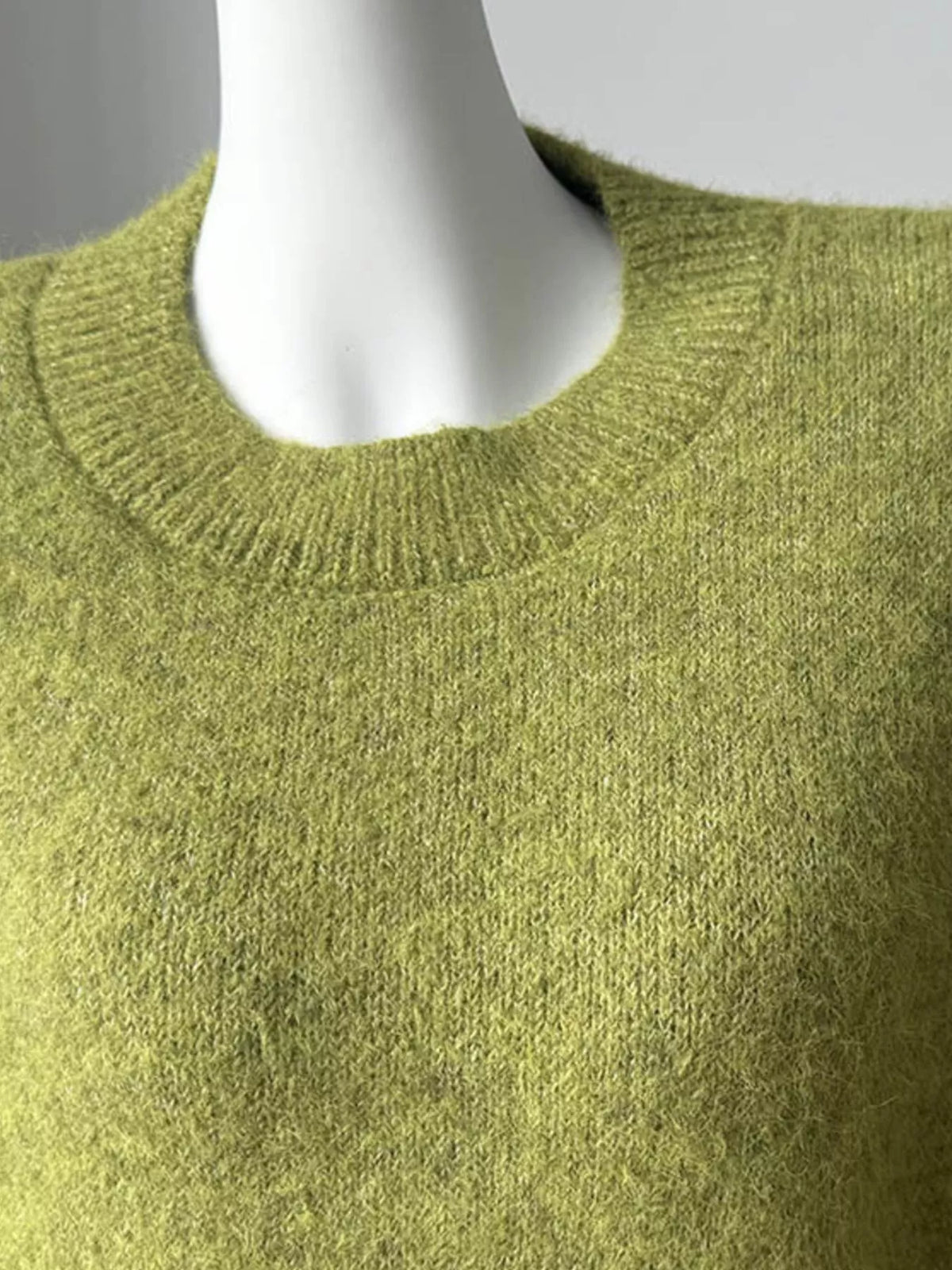 round neck dropped shoulder sweater fabric detail close up