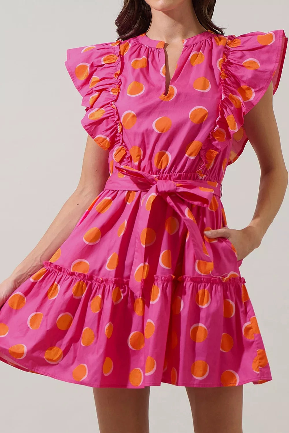 Deep rose polka dot mini dress front view on model