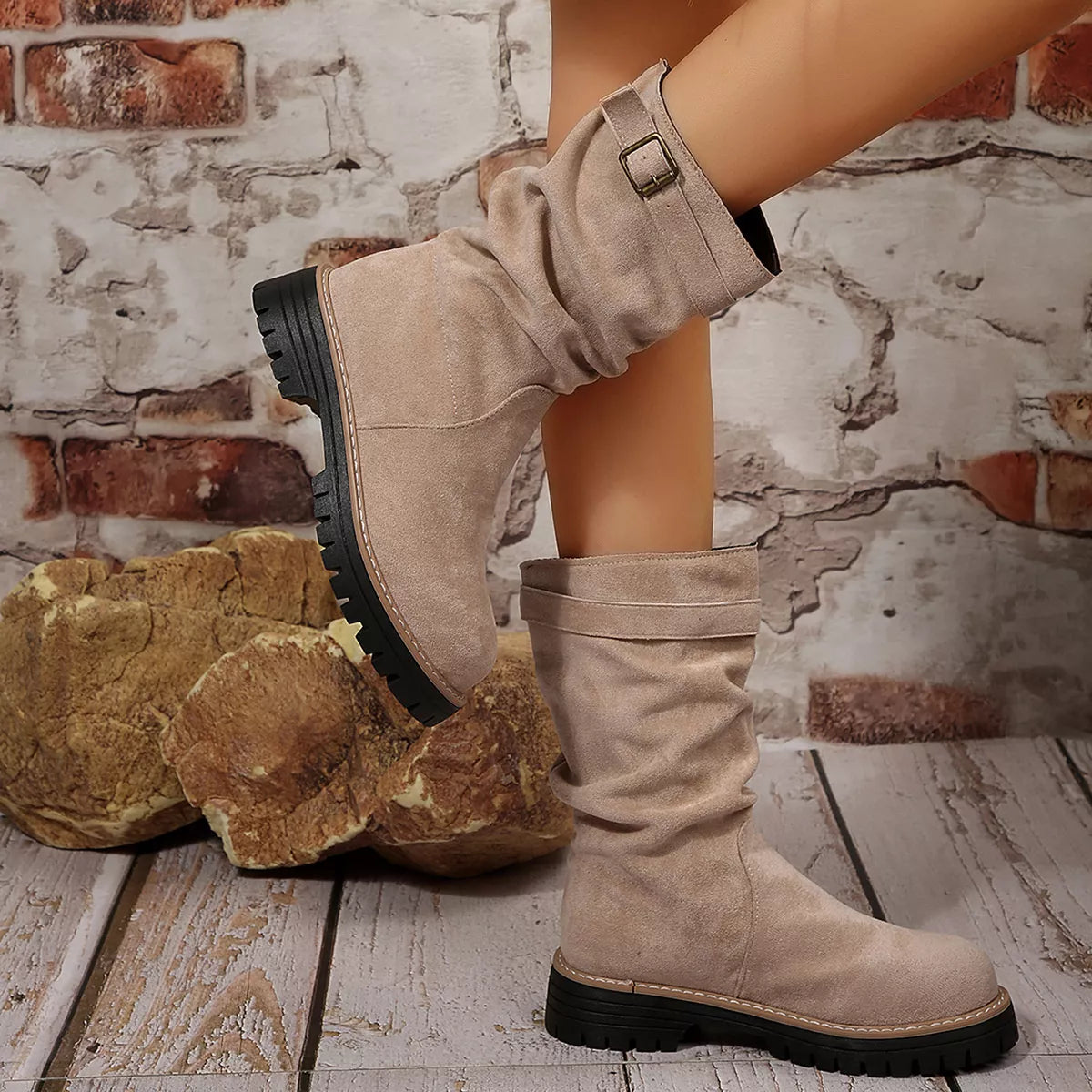 Buckle accent slouch boots close up detail
