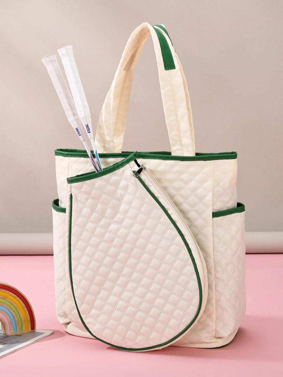 Quilted racket backpack shown worn by model