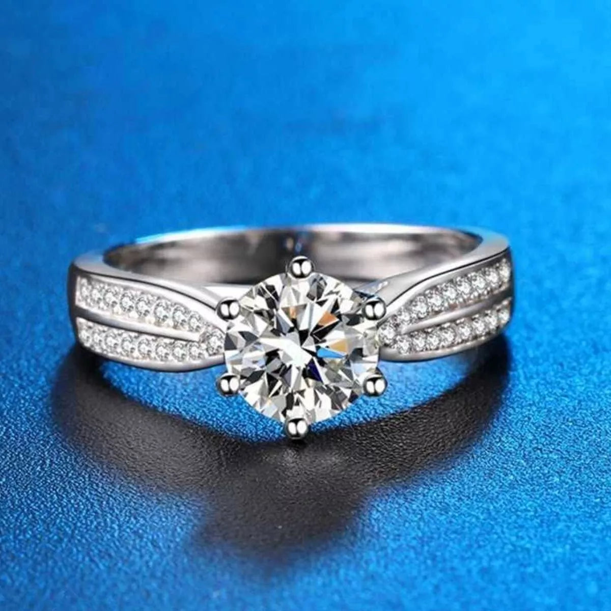 The moissanite ring shown worn on the hand