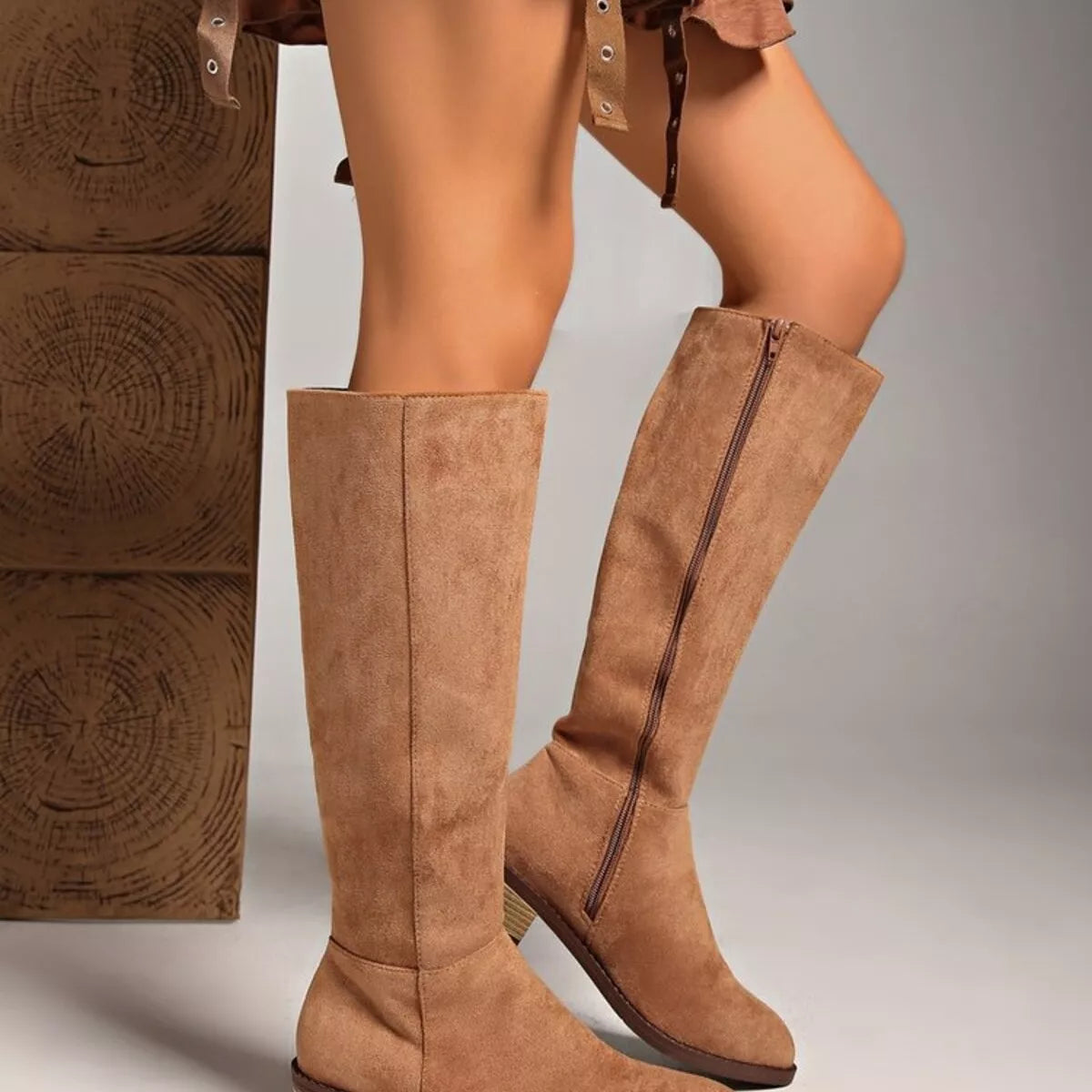 Knee high block heel suede boots styled on model