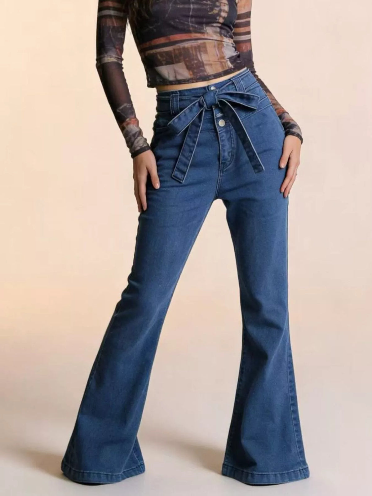 Bow tie waist detail on flare denim