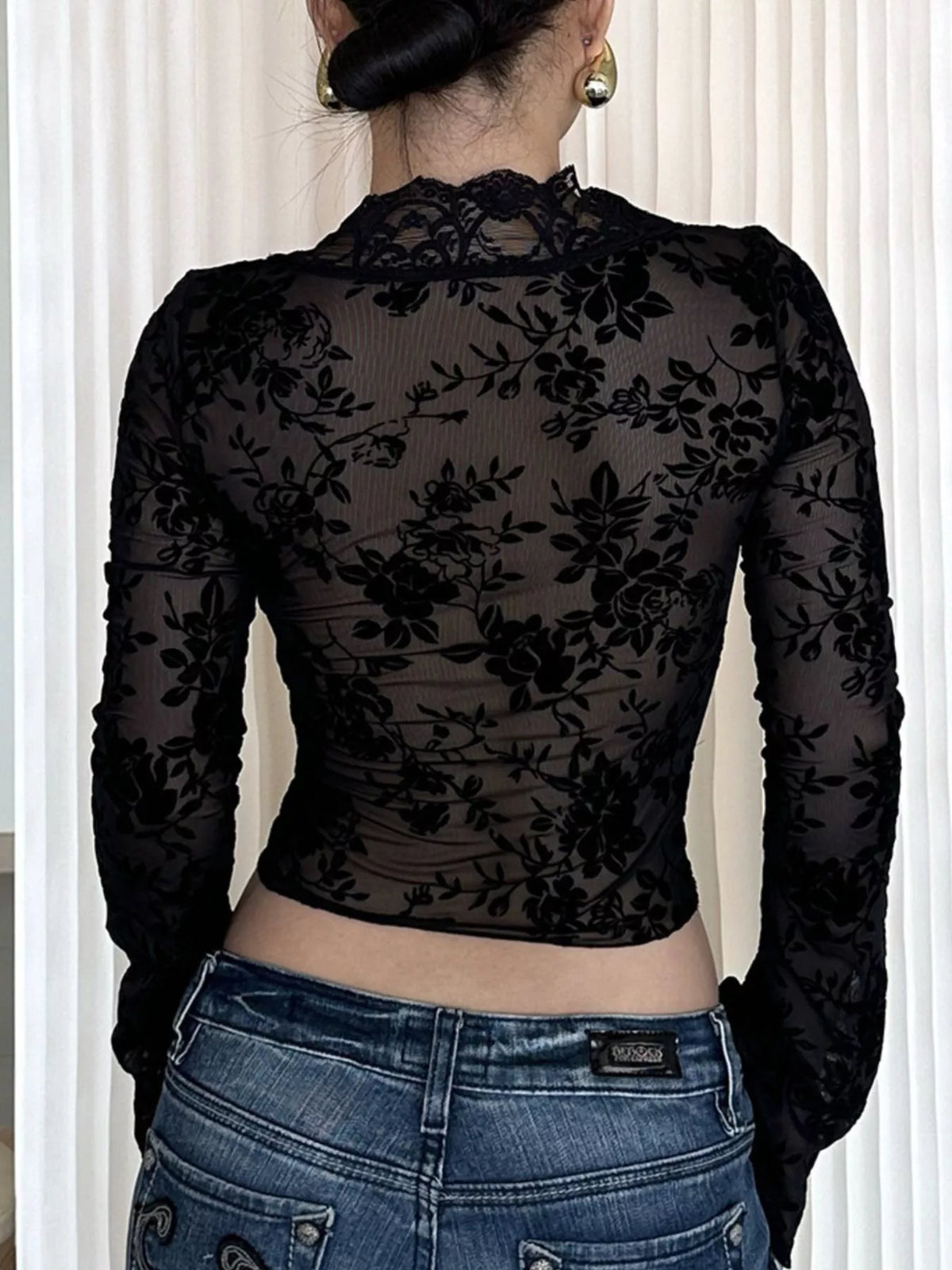 Long sleeve and cuff detail on the black lace top