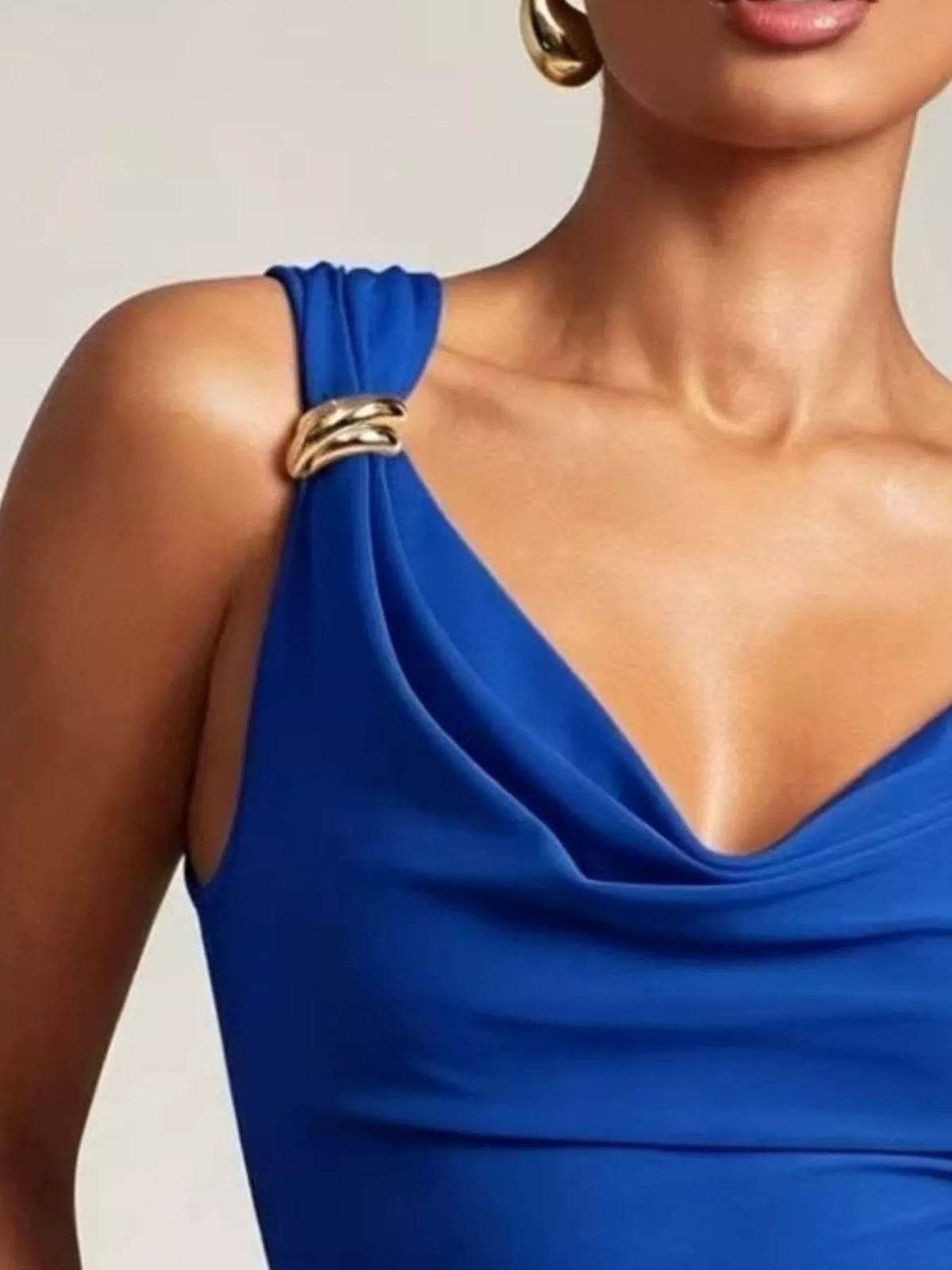 Black cowl neck tank with metal ring accents detail view
