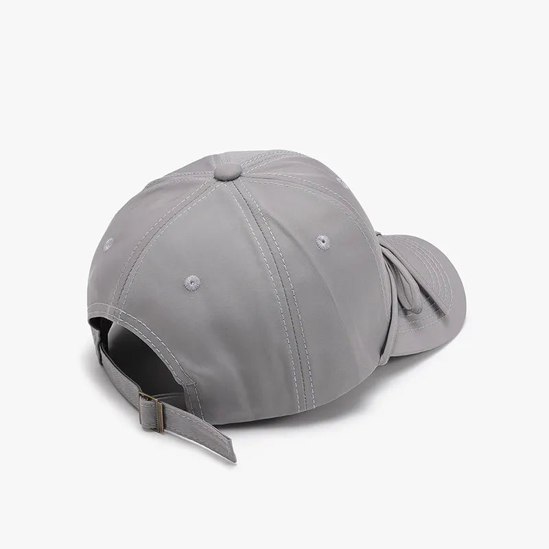 Back view of baseball cap with tied bow detail
