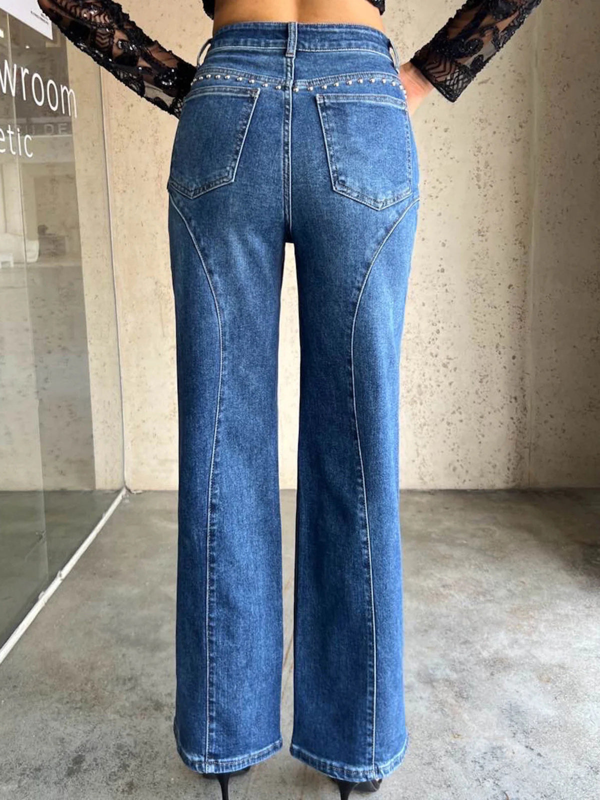 Wide leg studded jeans on model