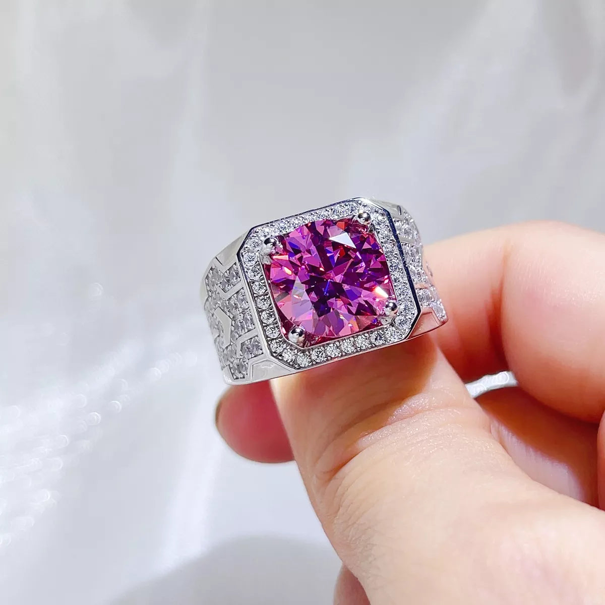 Pink moissanite cocktail ring worn on the hand