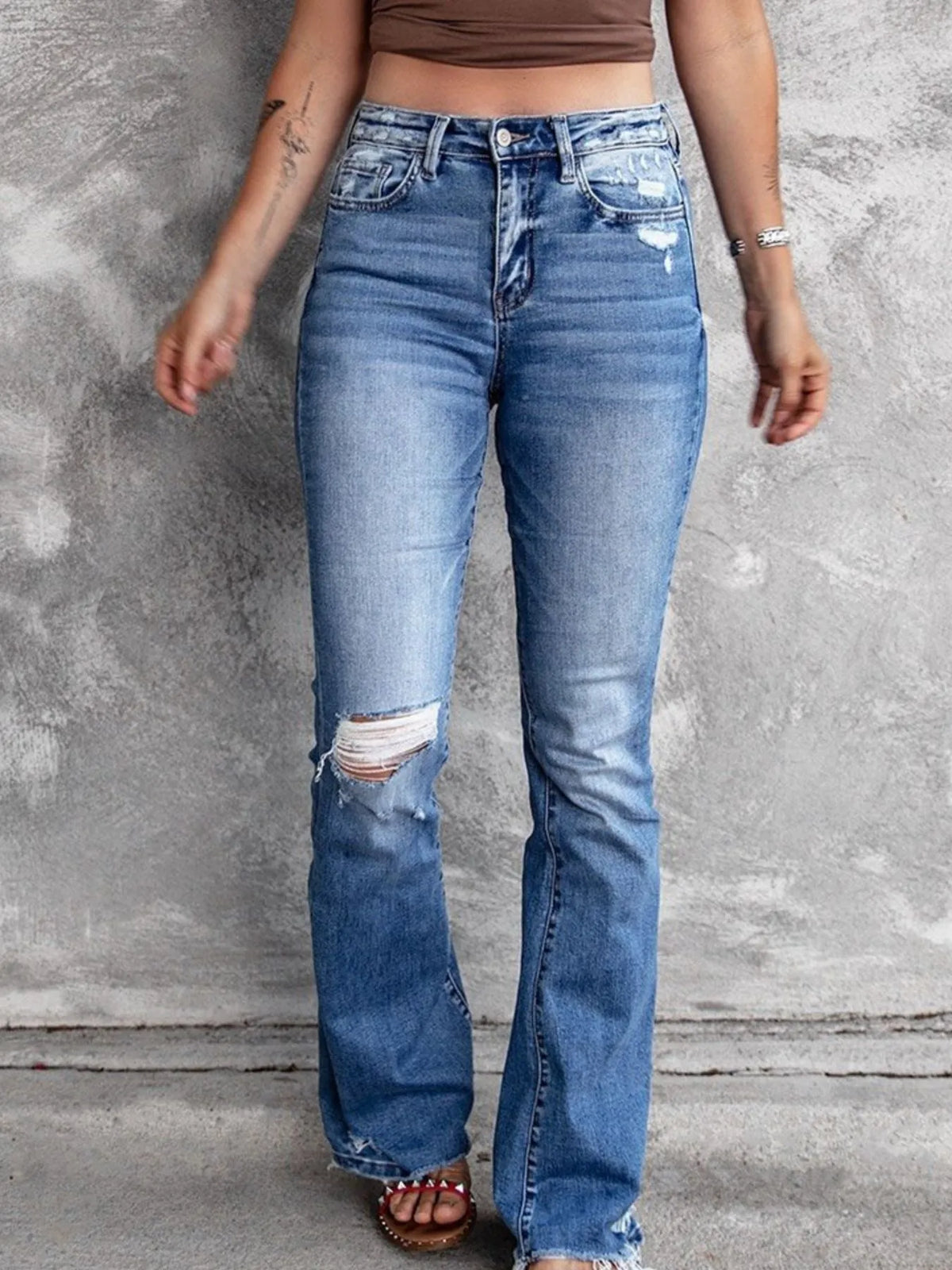 Flare jeans showing distressing and rips