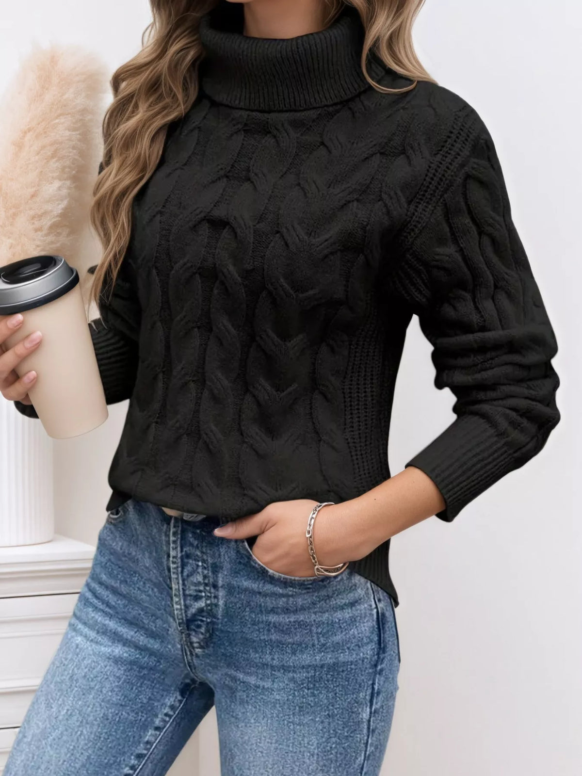 Cable knit turtleneck long sleeve sweater hem detail