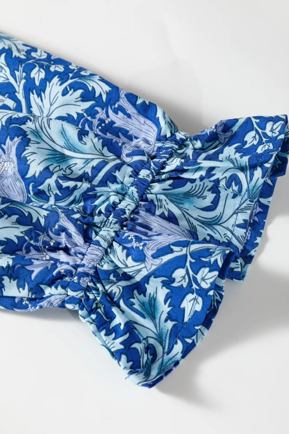 Dusty blue floral V neck tiered maxi dress side view