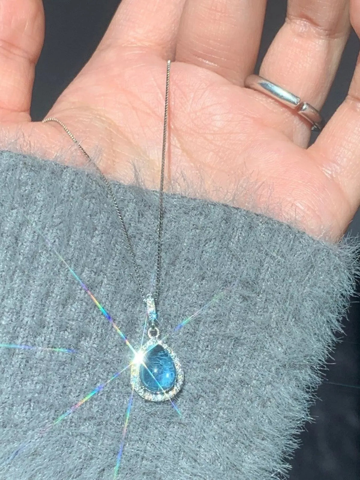 Crystal teardrop pendant sterling silver necklace, side view