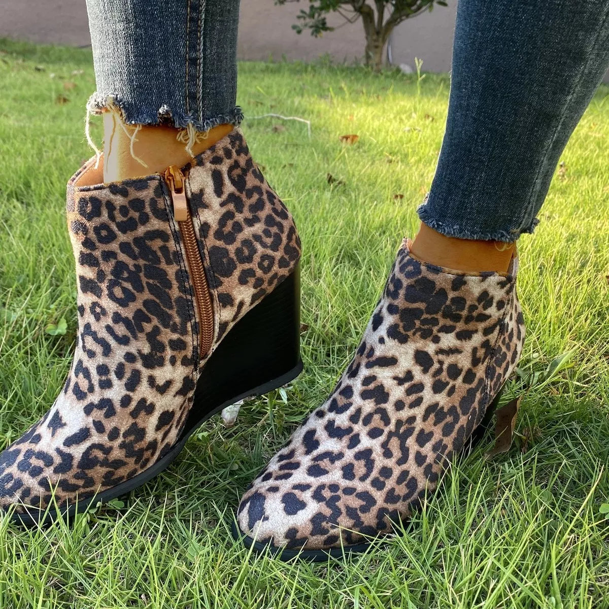 Round toe wedge ankle boots worn with cropped jeans