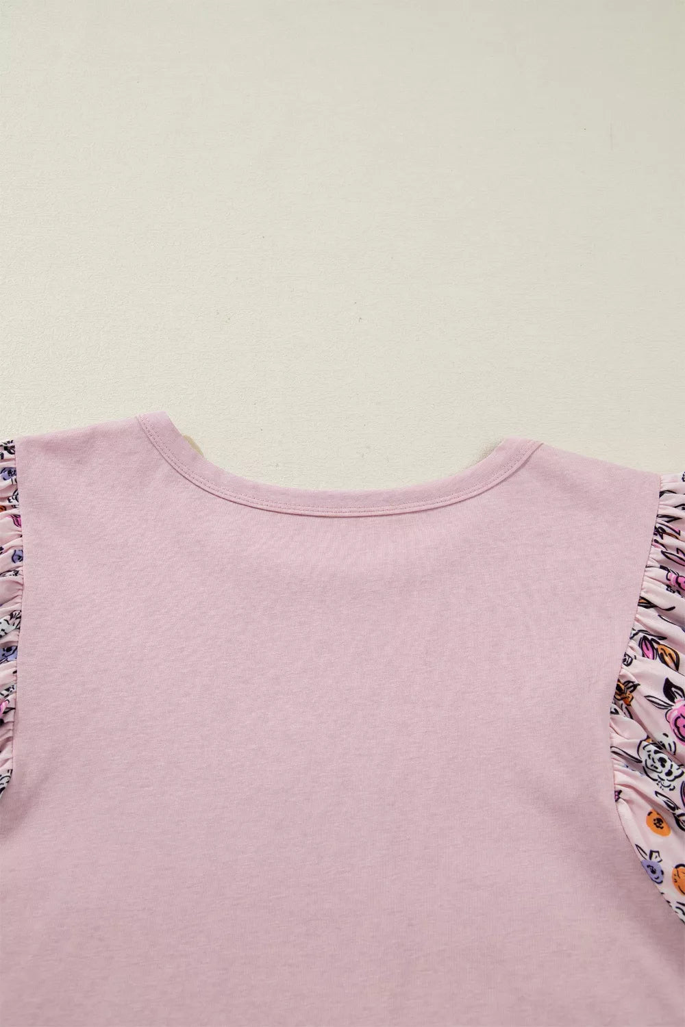 Dusty pink bell sleeve blouse hem detail